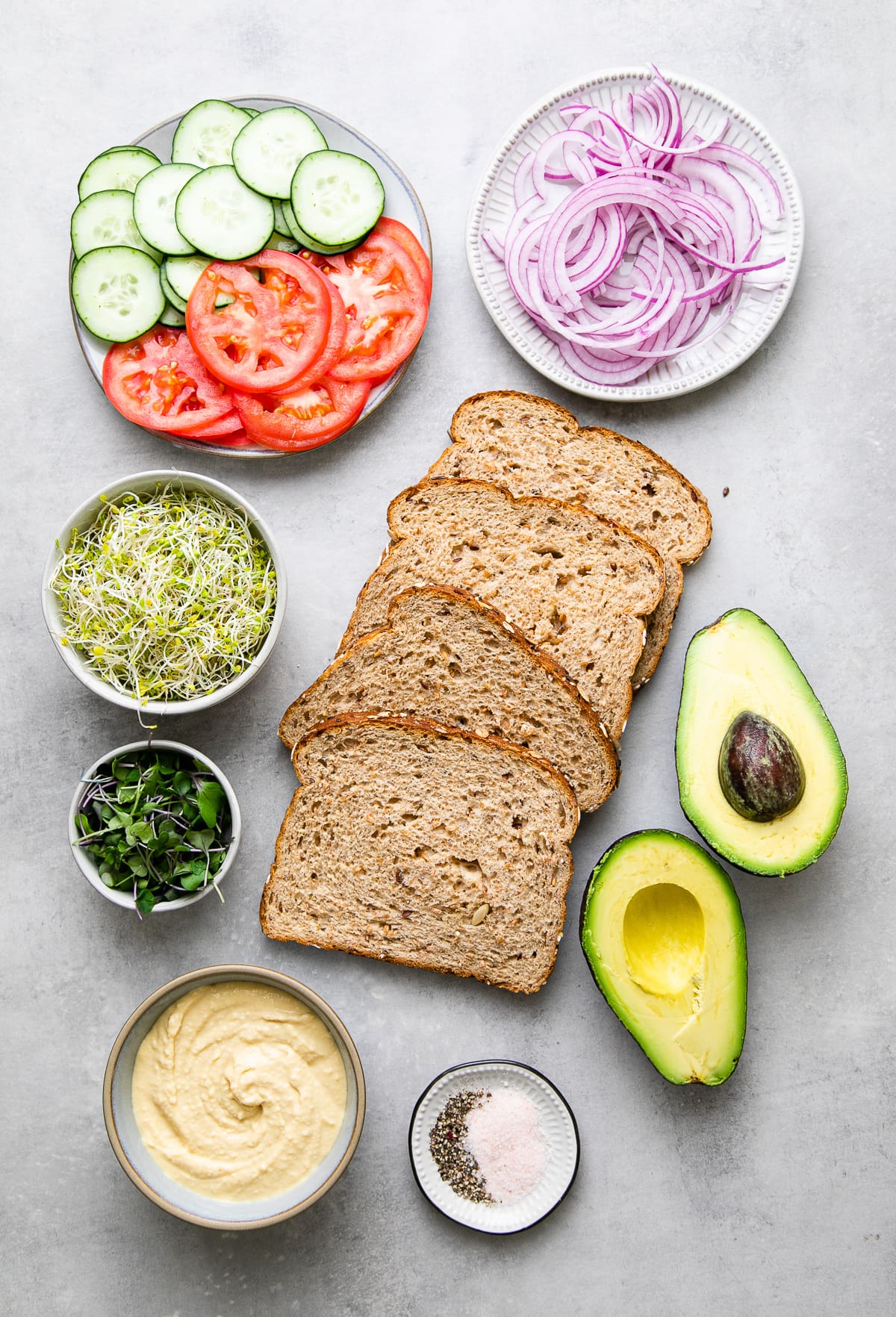 top down view of ingredients used to make healthy hummus veggie sandwich.