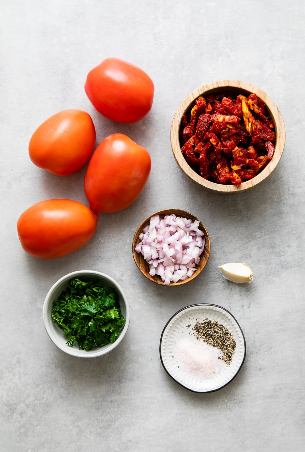 top down view of ingredients used to make raw marinara sauce recipe.