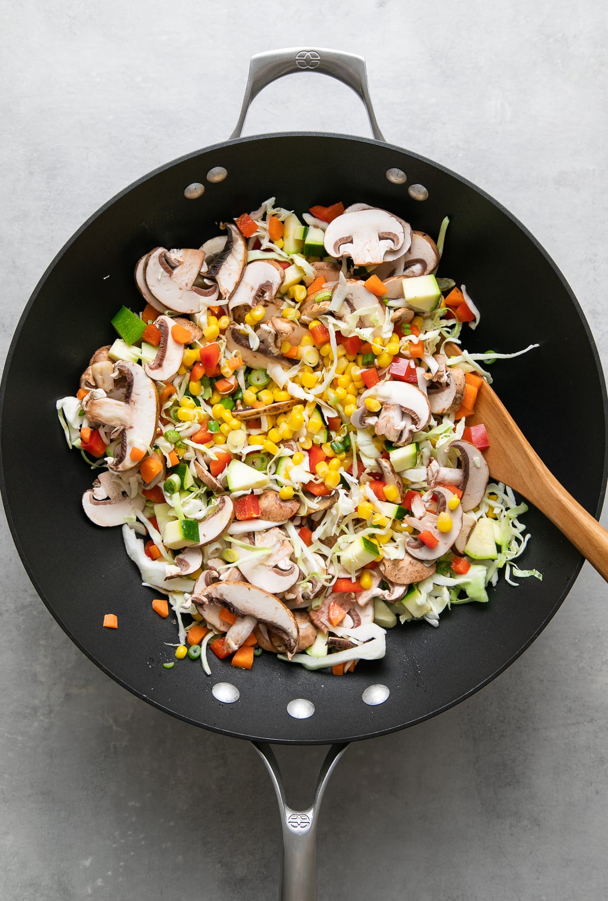 top down view showing the fresh veggies added to wok and ready to stir fry.