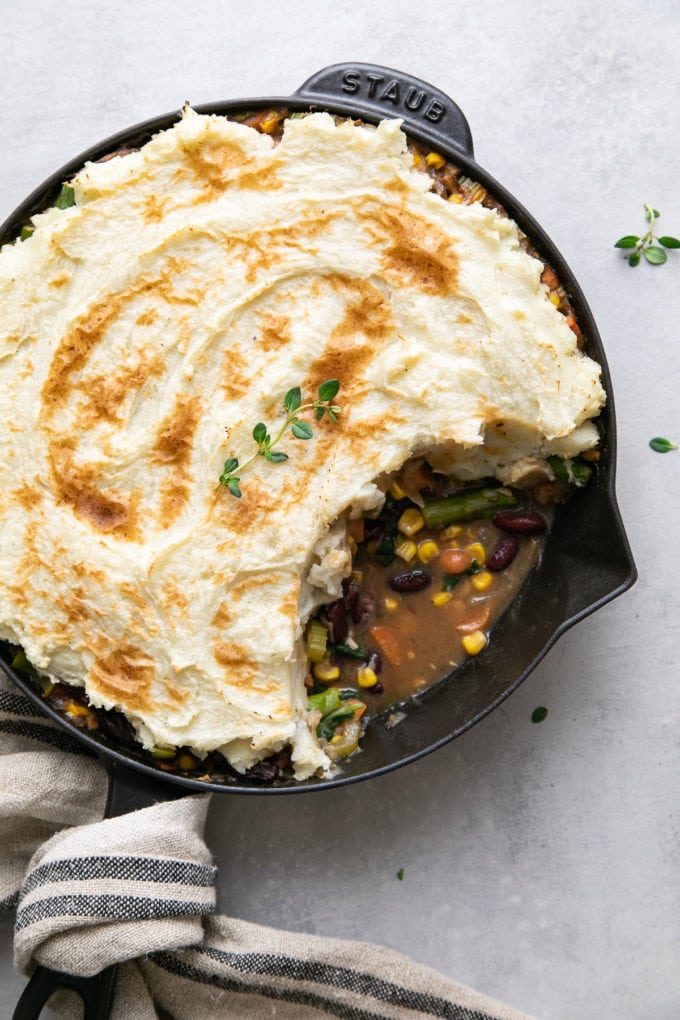 top down view of skillet shepherds pie with portion removed.