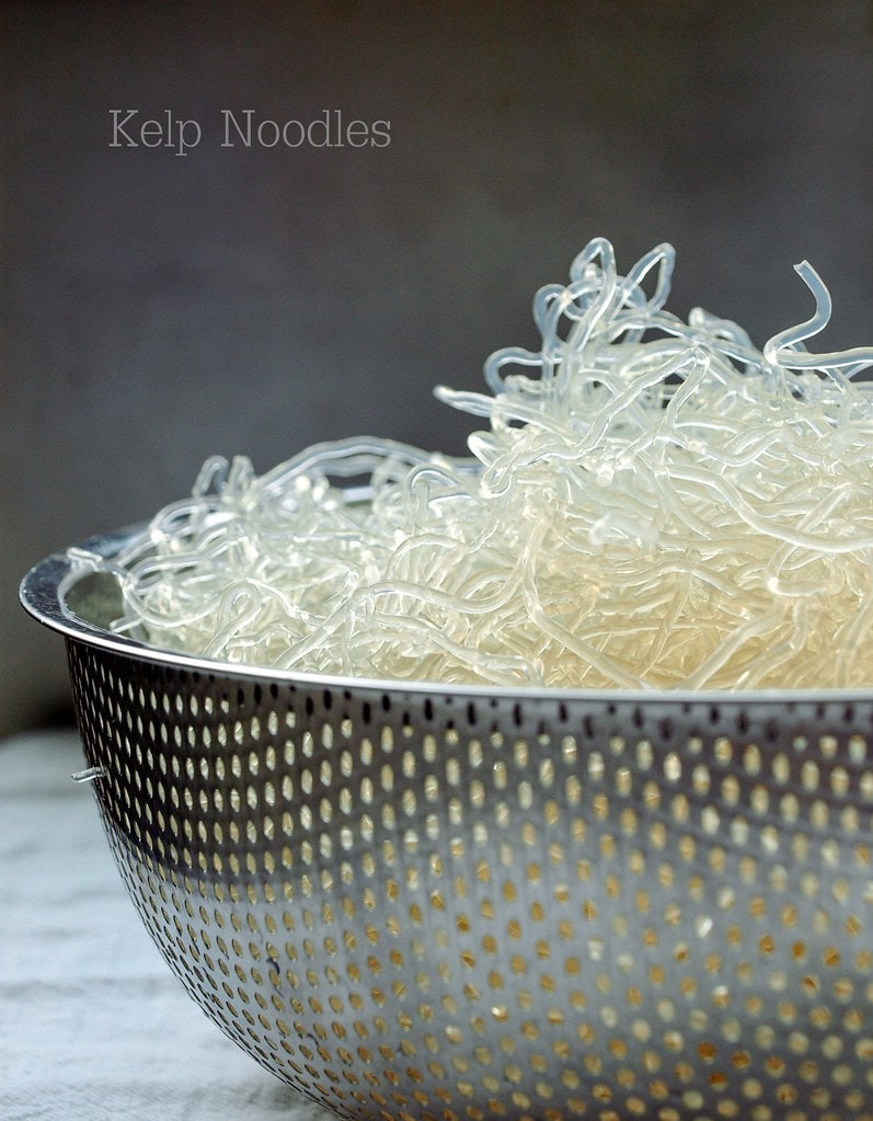 head on view of kelp noodles in a strainer.