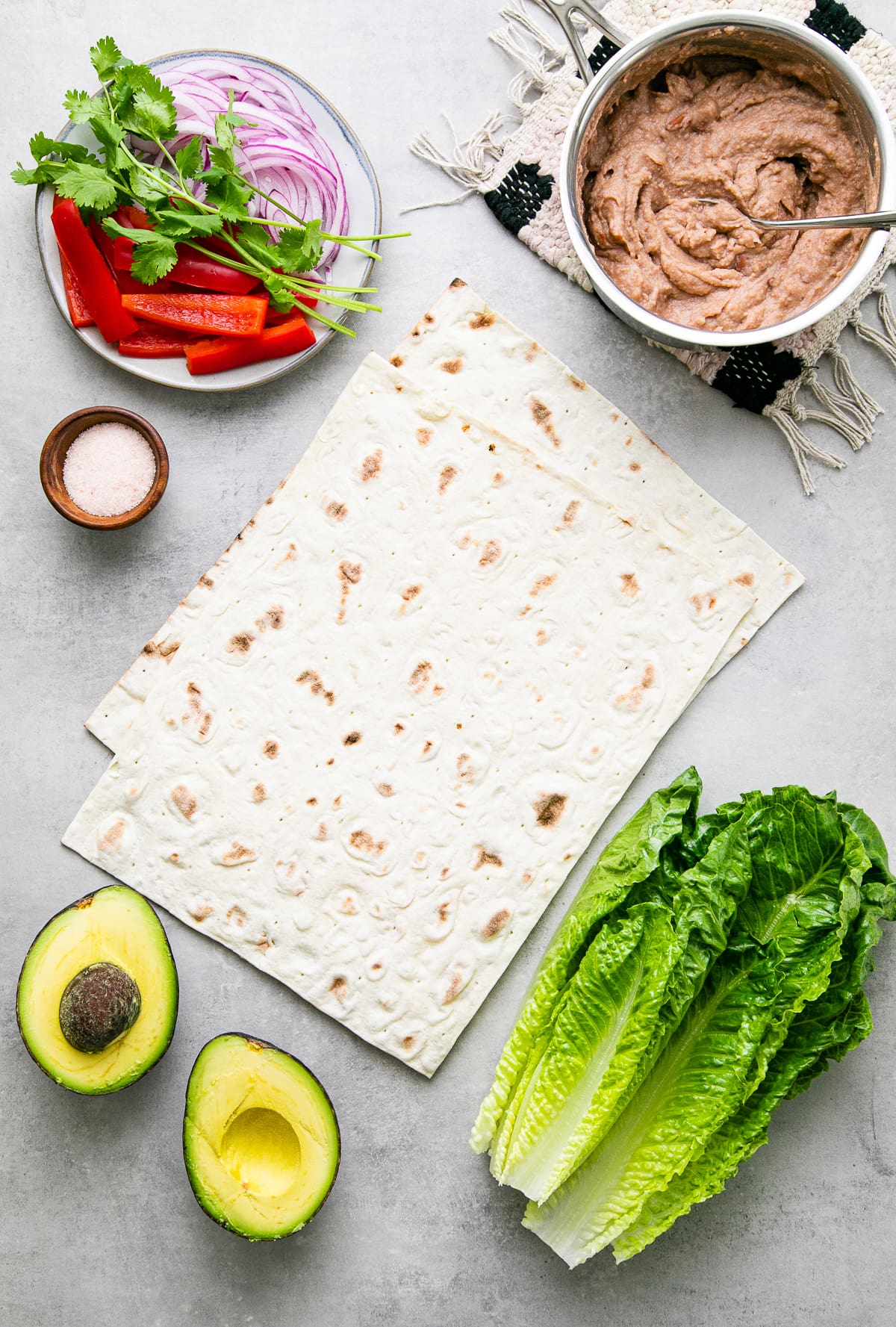 top down view of ingredients used to make refried bean avocado lavash wraps.