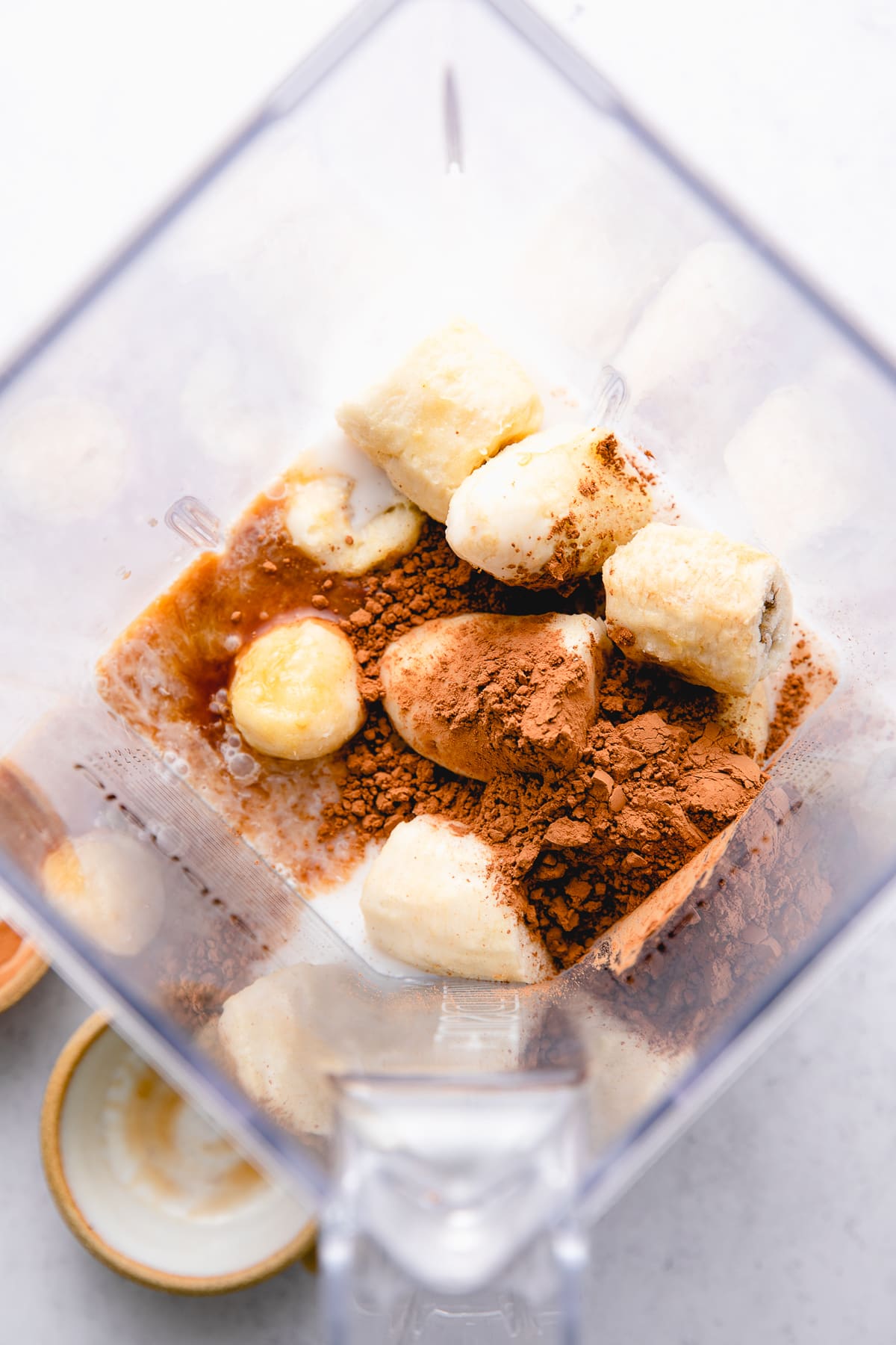 top down view of ingredients used to make healthy vegan chocolate milkshake recipe.