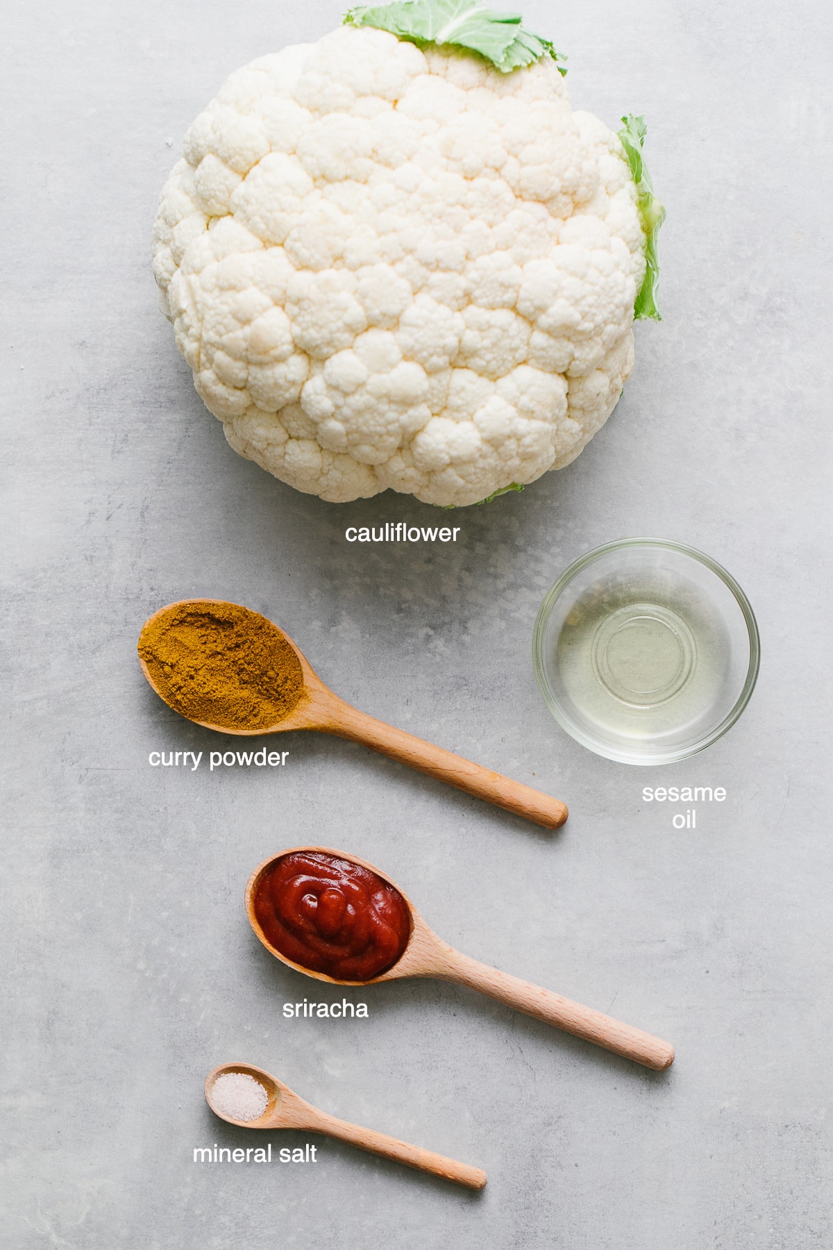 top down view of ingredients used to make curry sriracha roasted cauliflower.