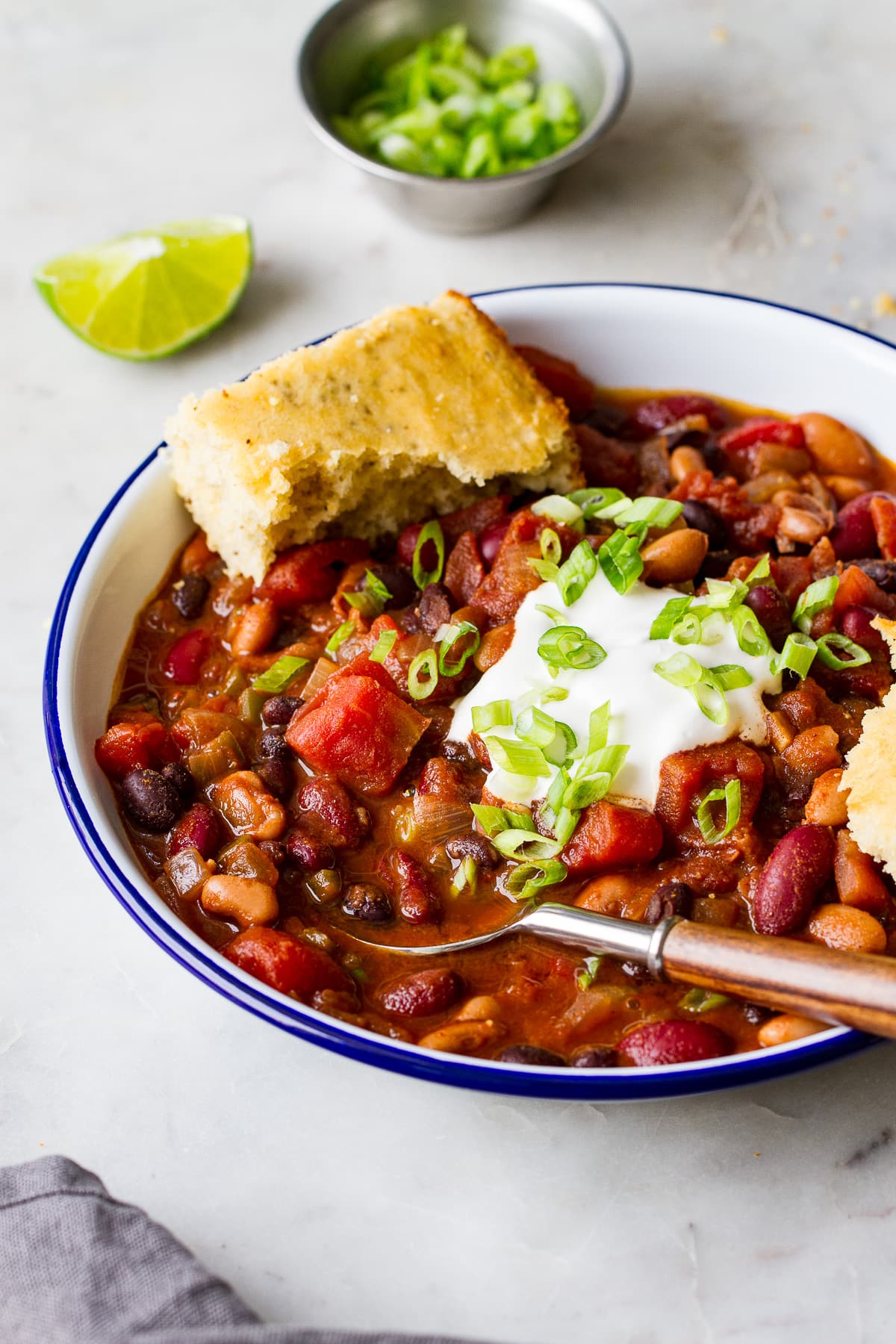 side angle view of a bowl full of quick and easy three bean chili.
