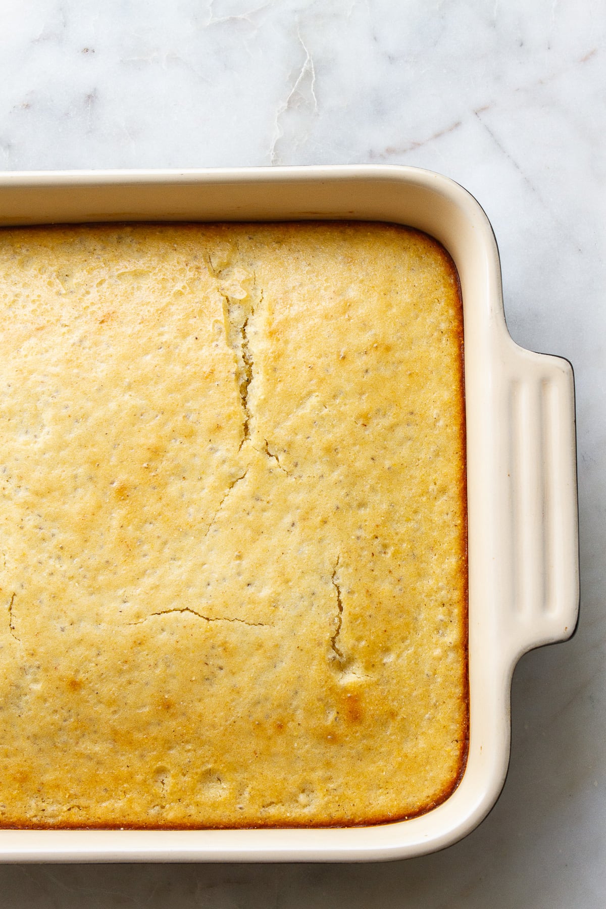 top down view of baking dish with just pulled from the oven sweet chia cornbread.