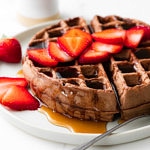head on view of vegan chocolate belgian waffle on a plate.