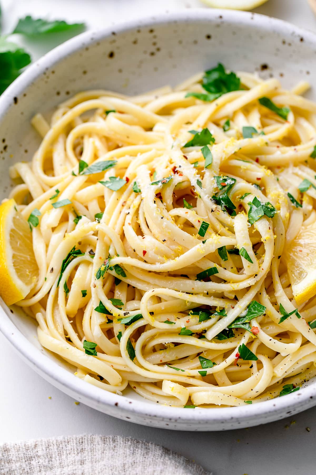 side angle view of plated lemon pasta.