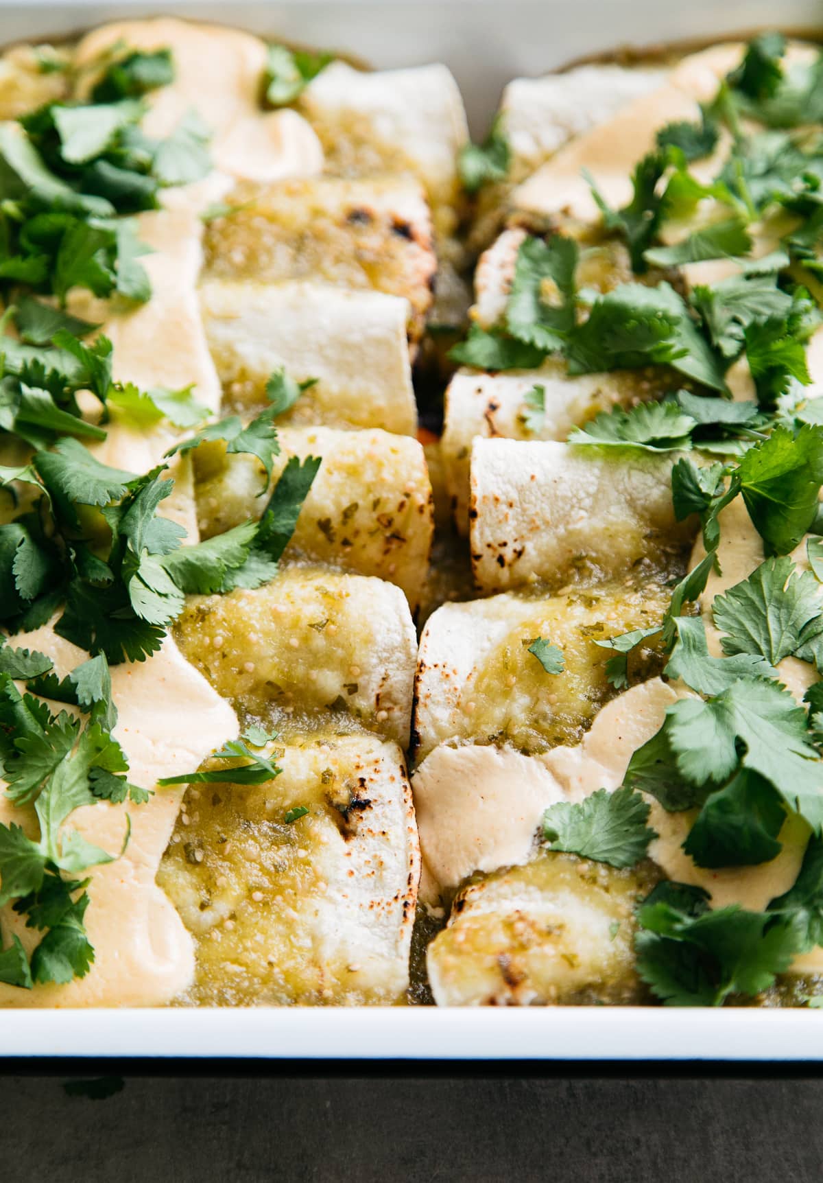 side angle view of homemade vegan enchiladas verde.