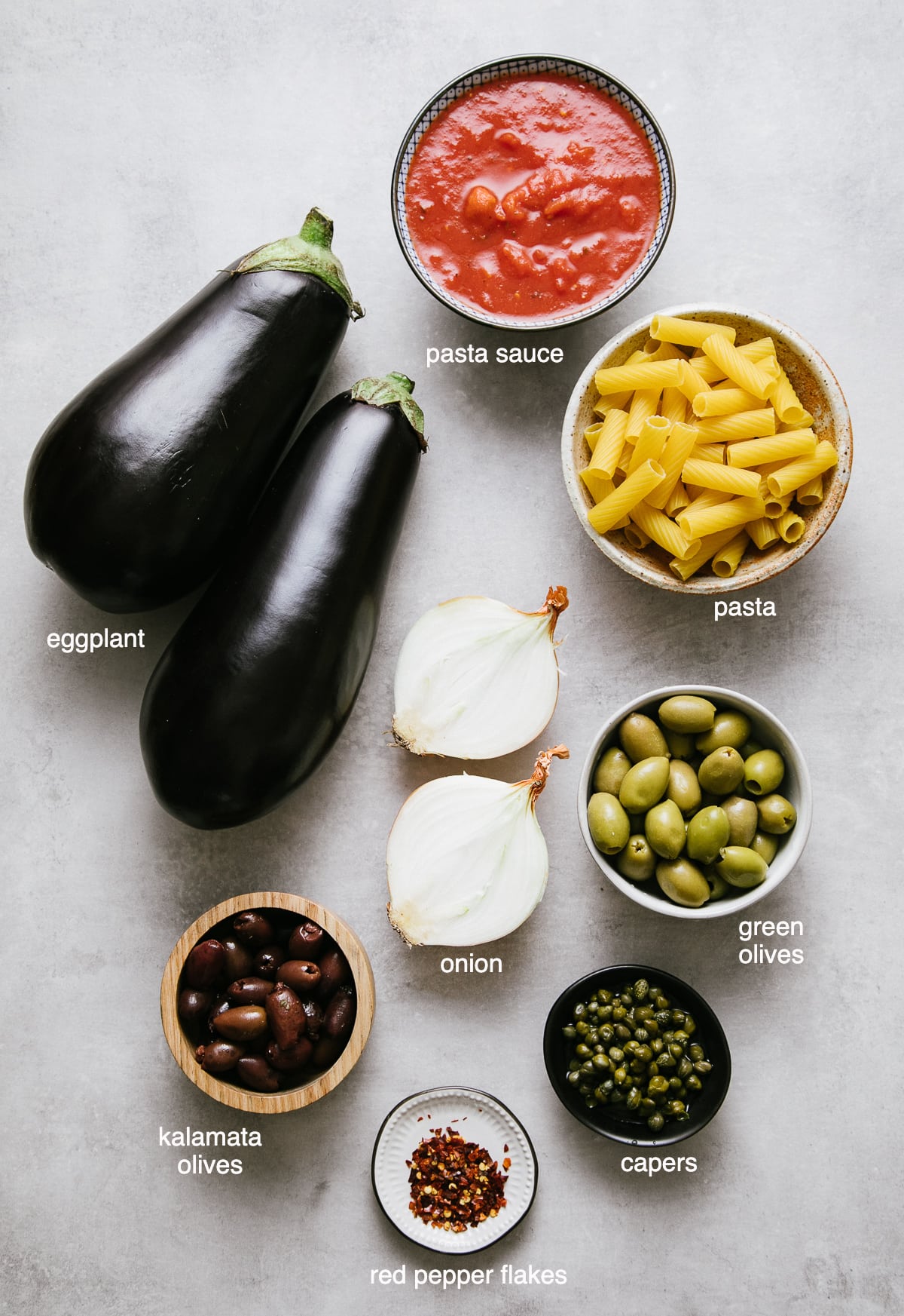 top down view of ingredients used to make eggplant puttanesca recipe.