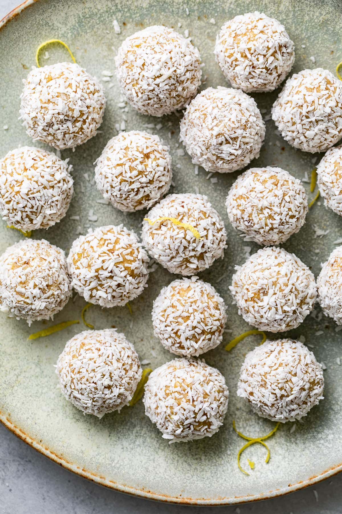 top down view of coconut lemon energy bites on a plate.