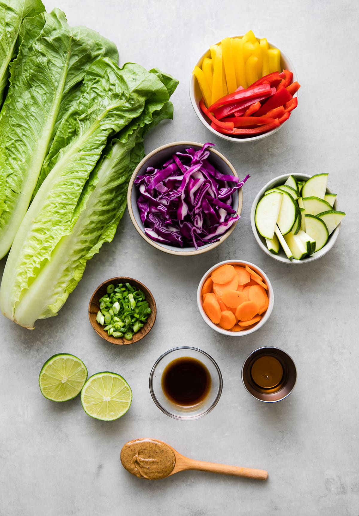 top down view of ingredients used to make crunchy romaine salad recipe with almond dressing.