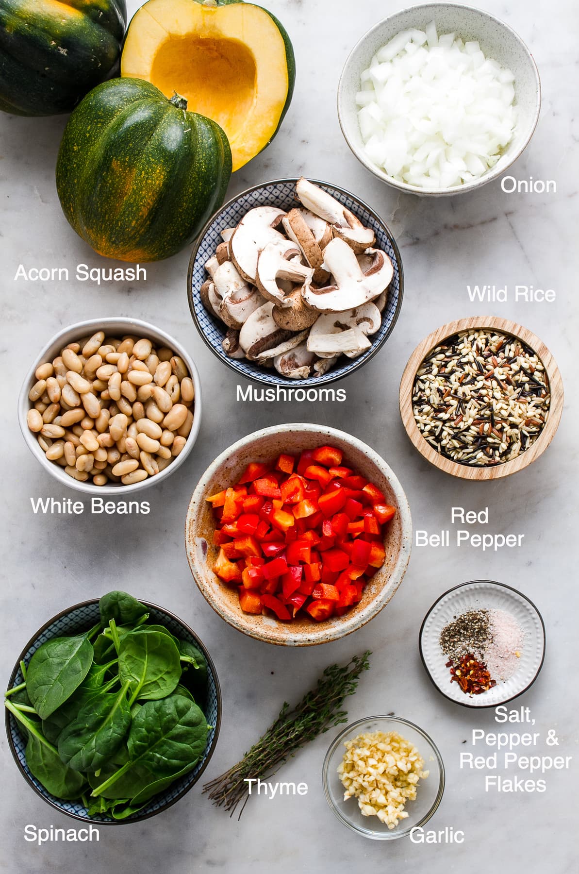 top down view of ingredients needed to make acorn squash and wild rice medley.