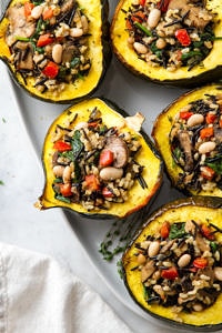 top down view of healthy roasted acorn squash with wild rice medley.