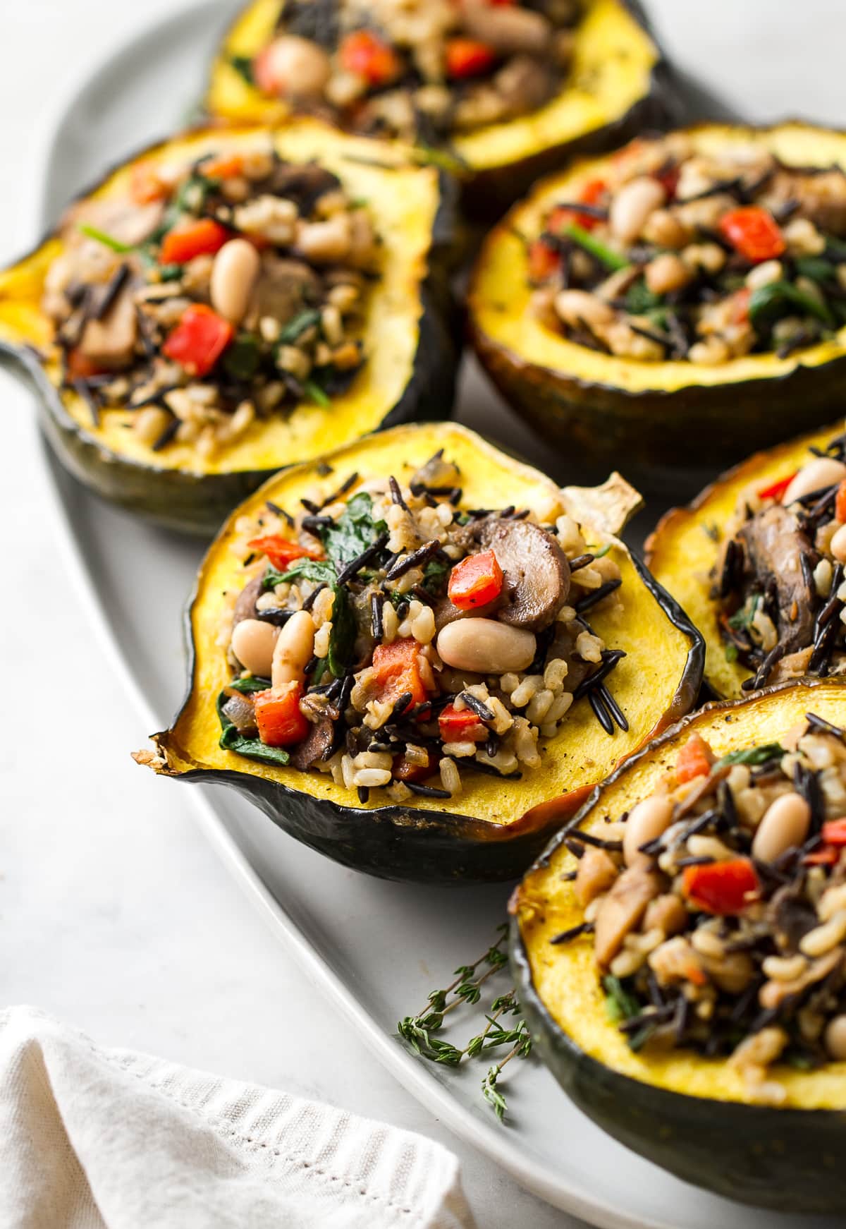 top down view of healthy roasted acorn squash with wild rice medley.