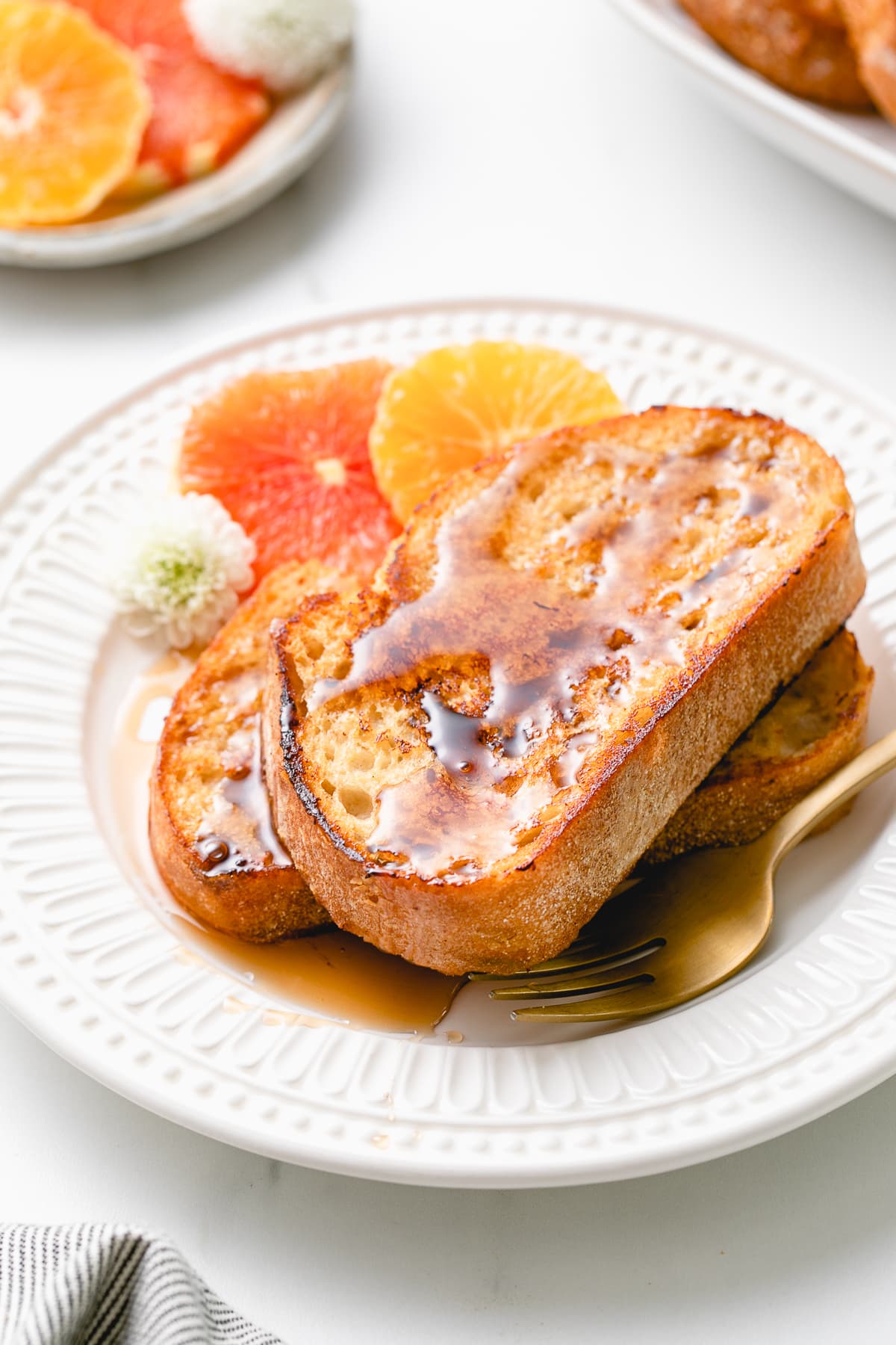 side angle view of plated vegan orange french toast.