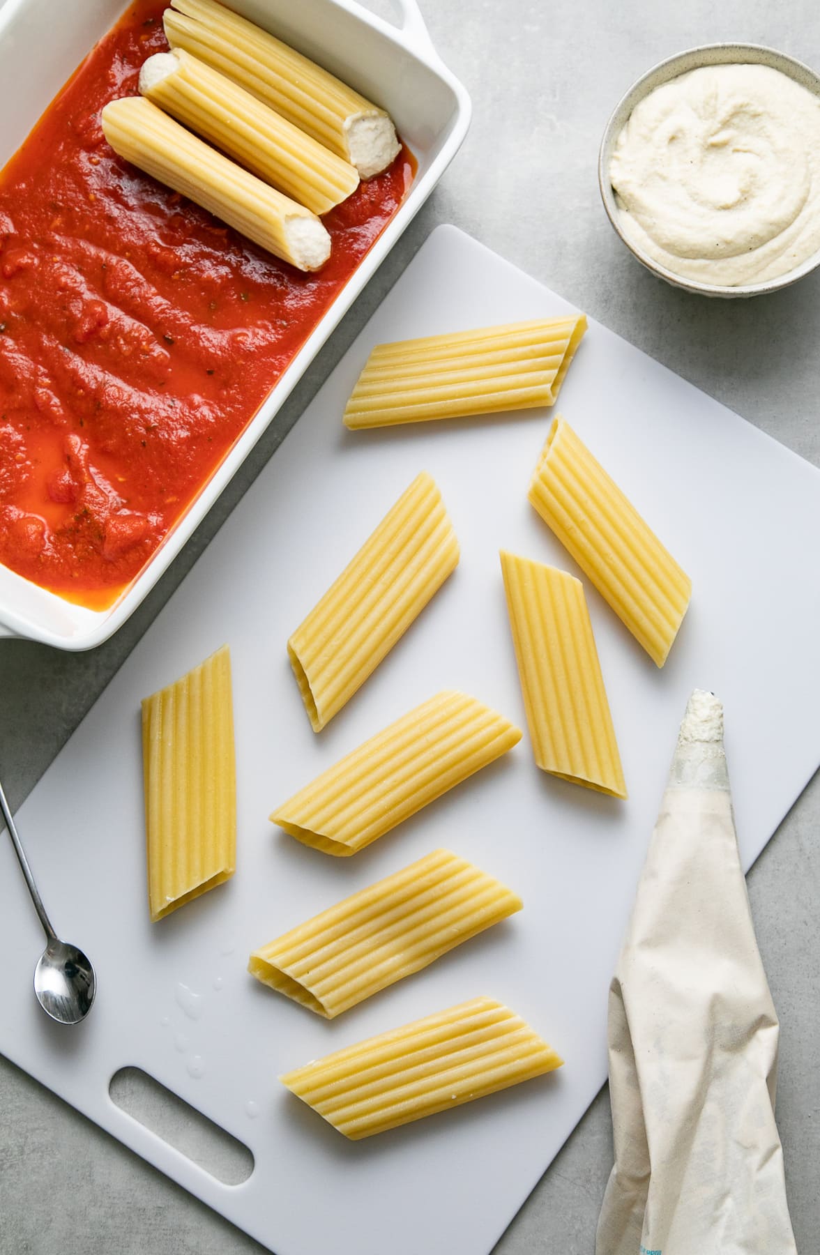 top down view showing the process of making vegan manicotti recipe.