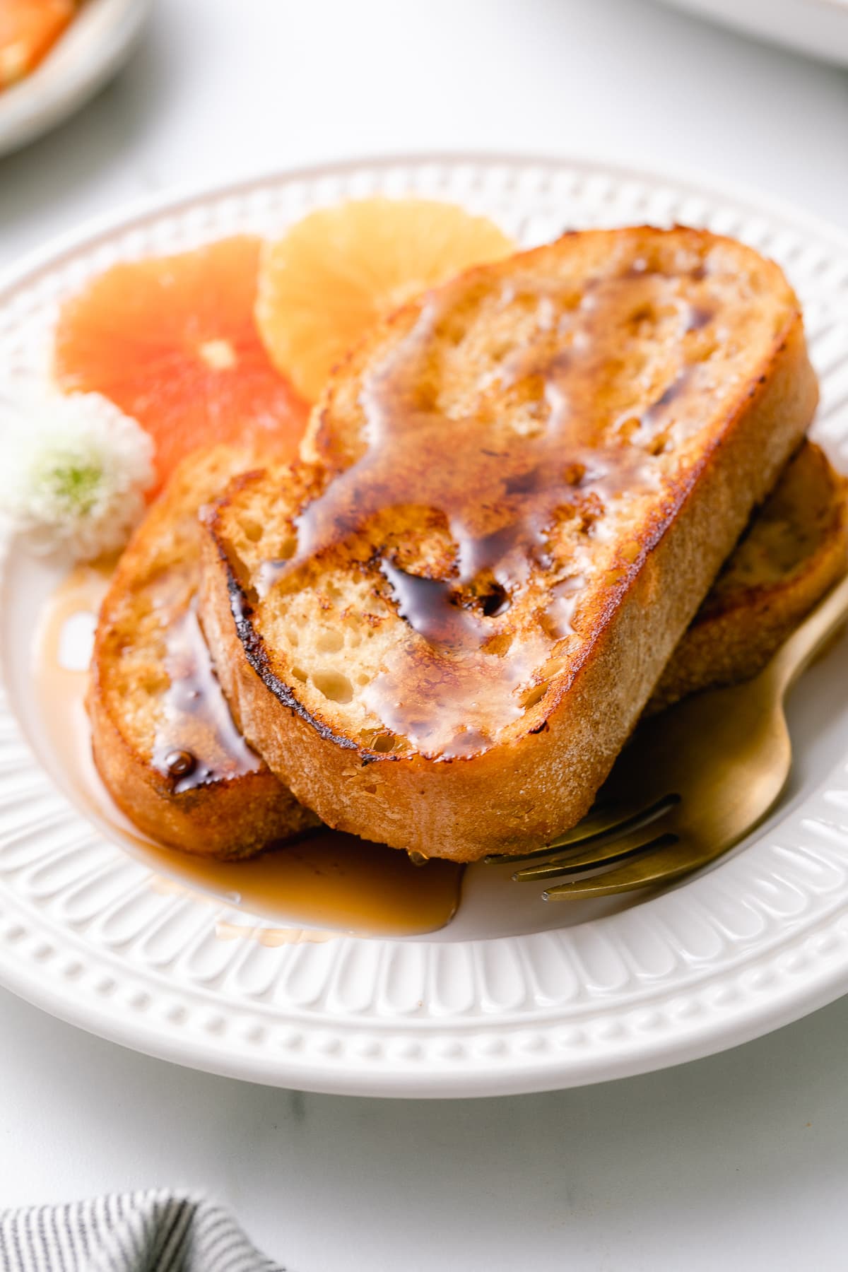 side angle view of plated vegan orange french toast.