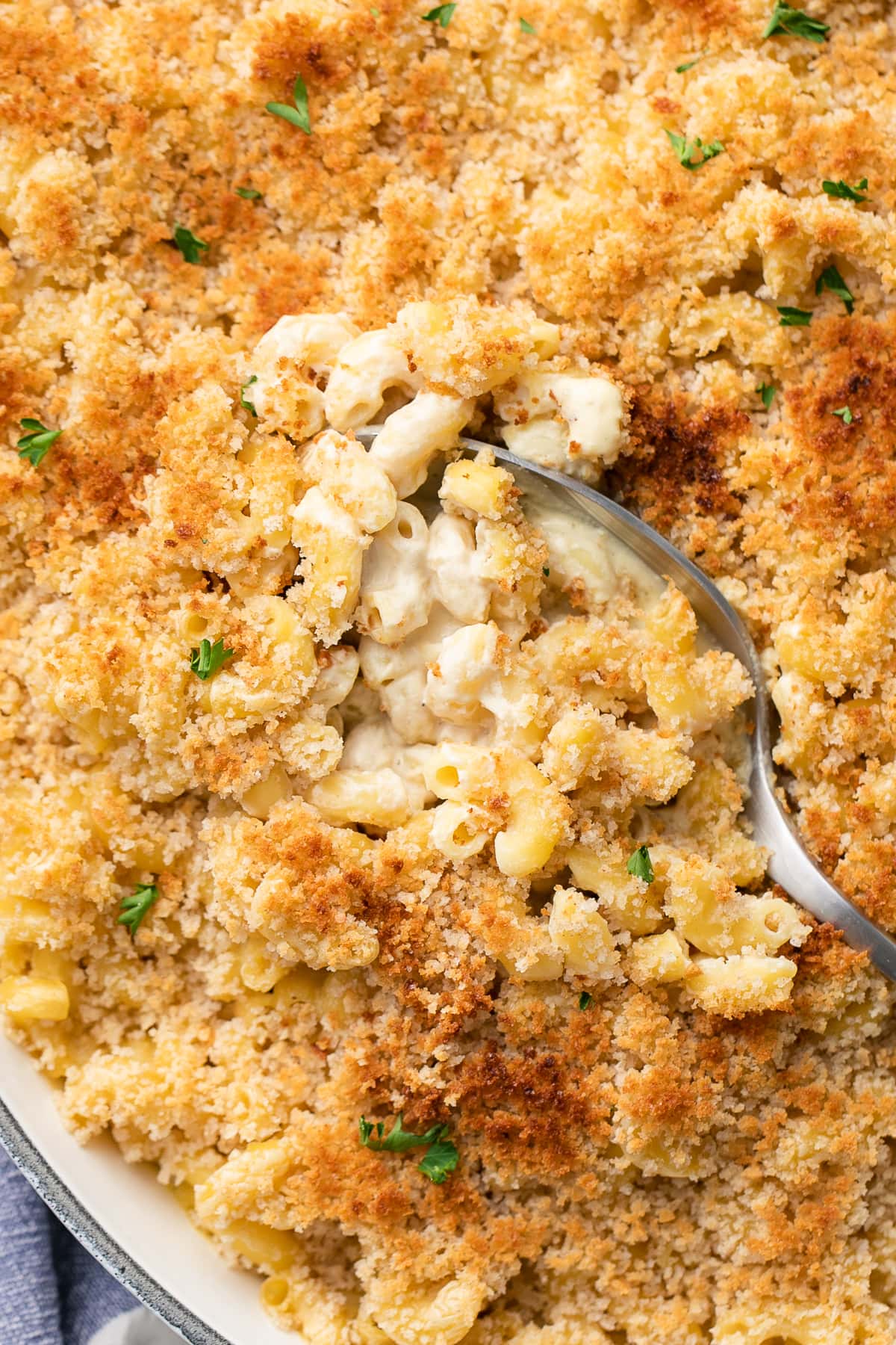 top down view of baked vegan mac and cheese with spoon.