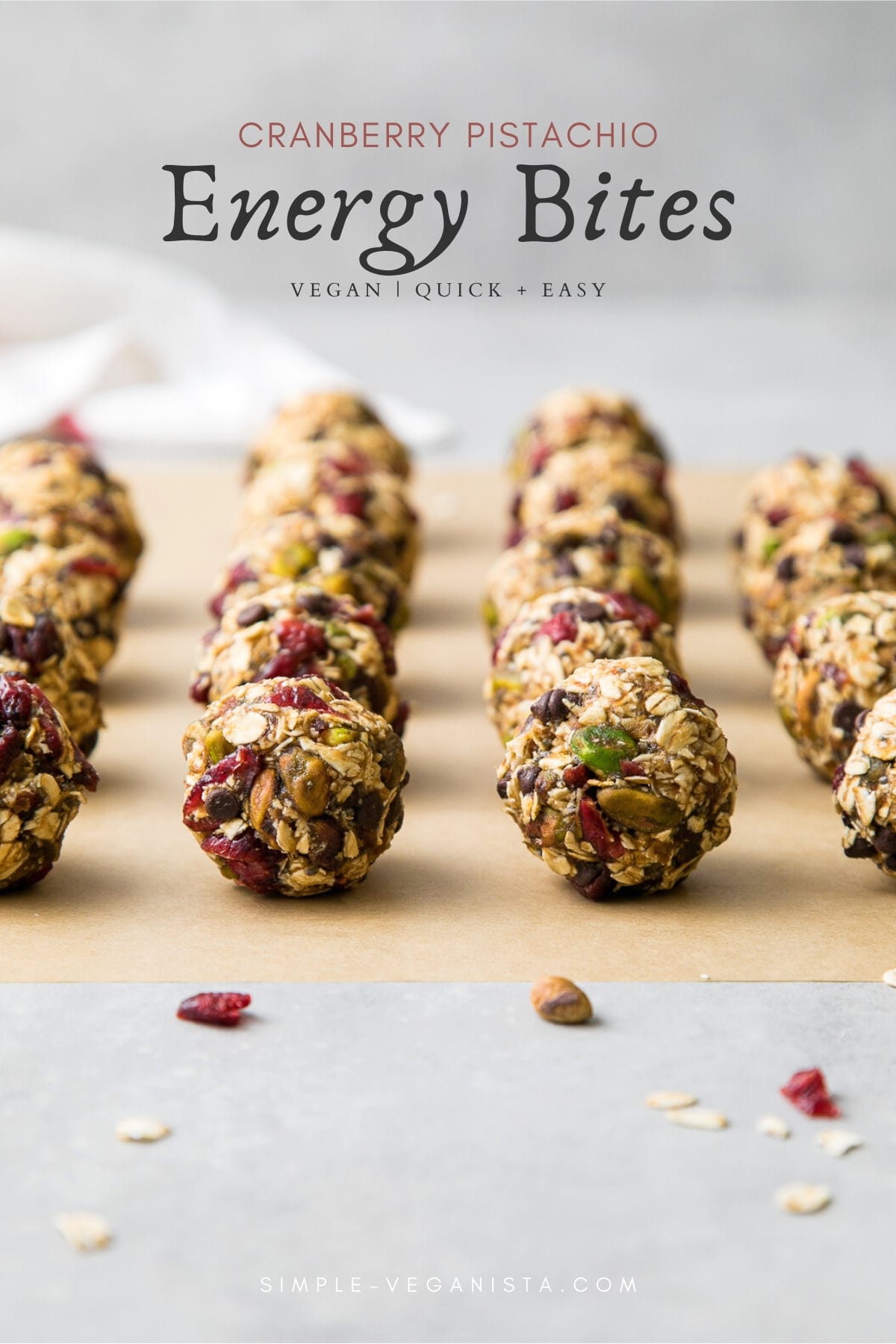 head on view of freshly rolled oatmeal energy bites with pistachios and cranberries.