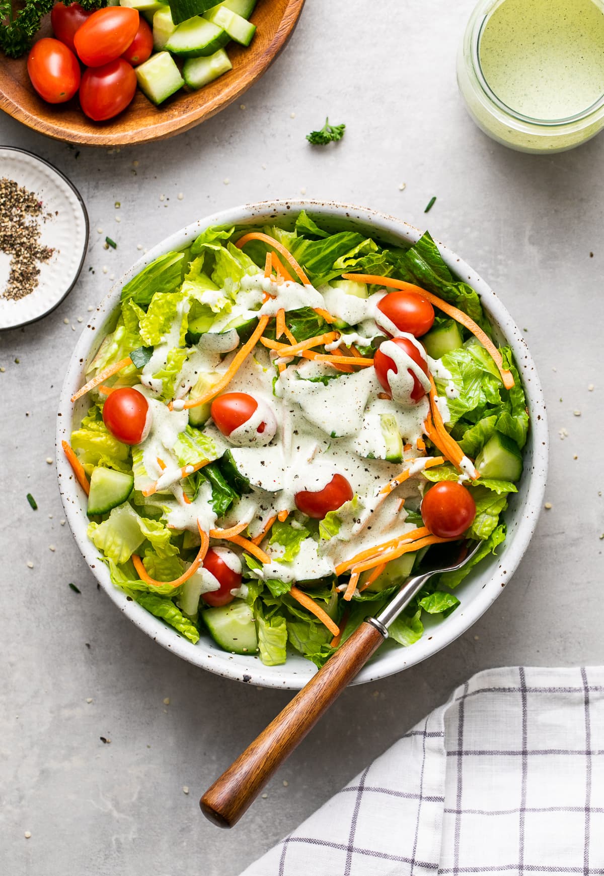 top down view of fresh green salad topped with creamy ranch style hemp seed dressing.