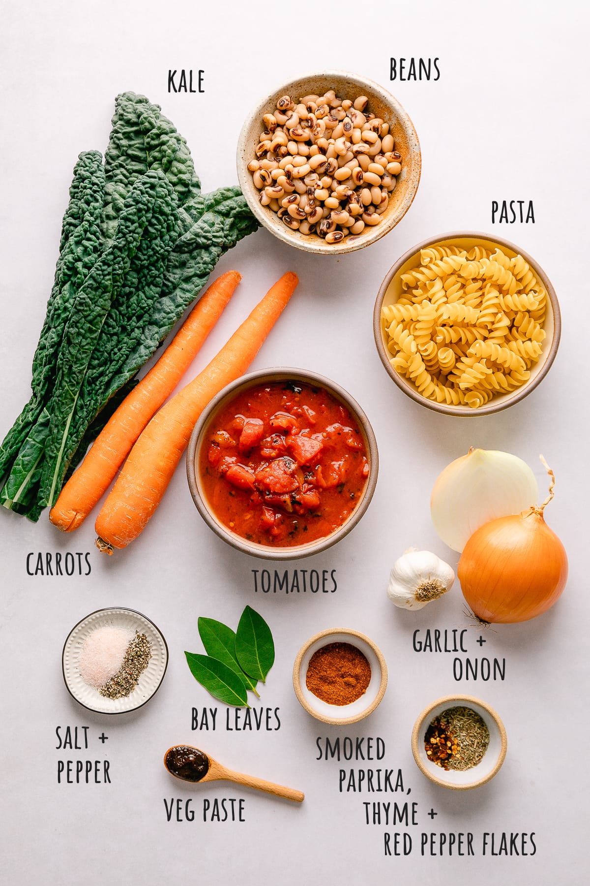 top down view of ingredients used to make healthy pasta and bean soup.
