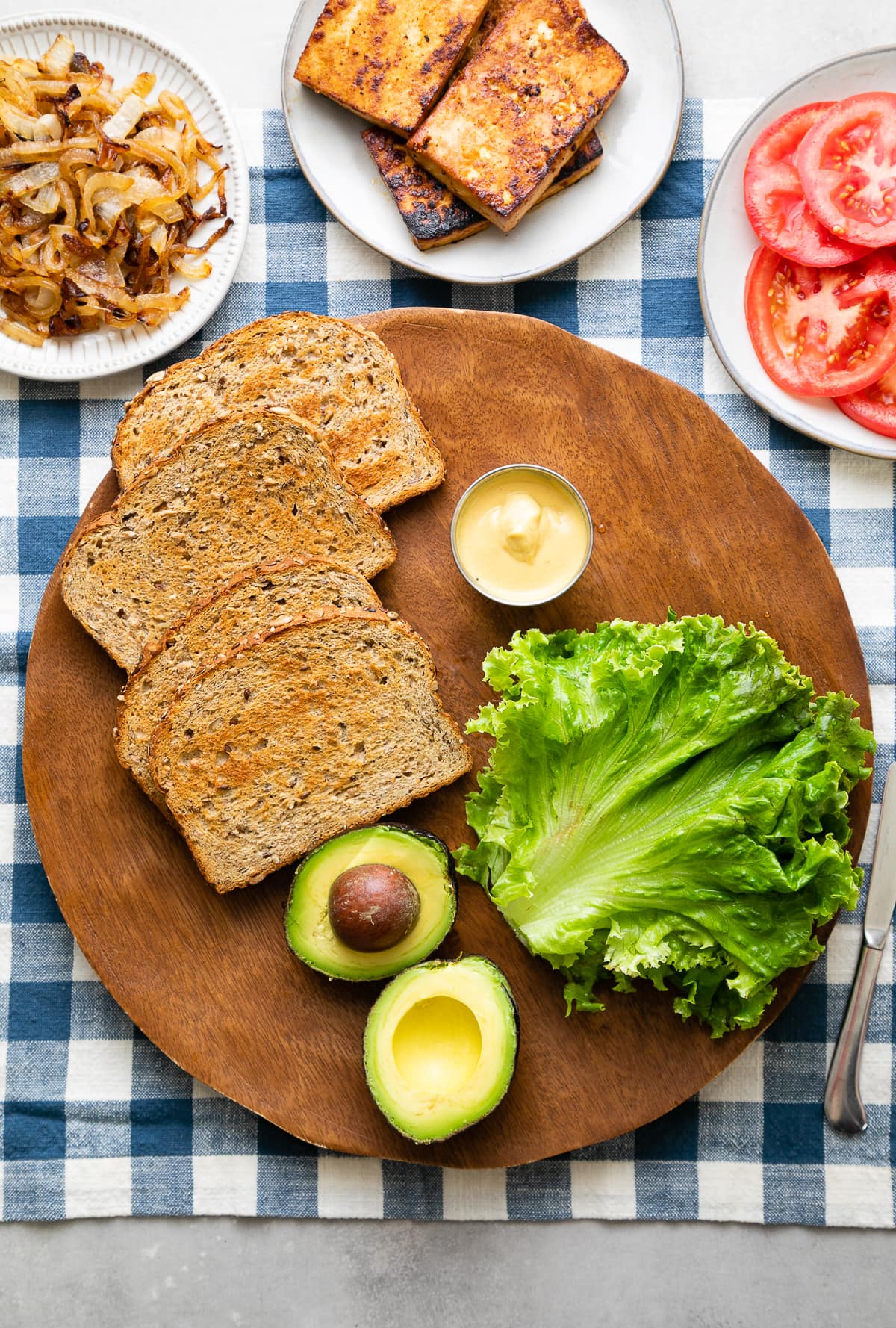 top down view of ingredients used to make the best smoky chipotle tlt tofu sandwiches.