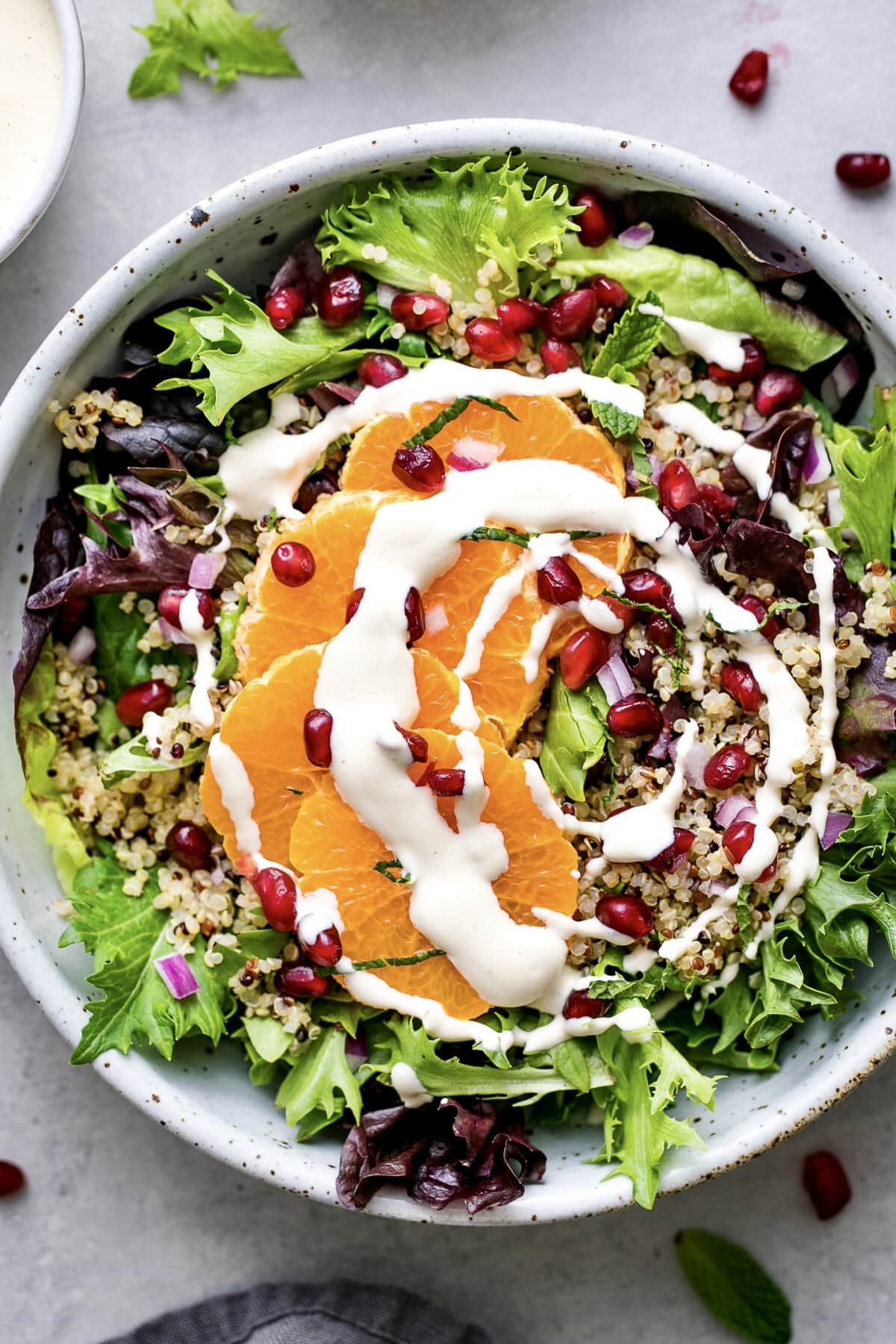 top down view of winter salad with items surrounding.