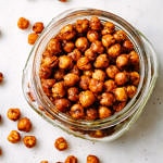 top down view of roasted chipotle chickpeas in a jar.
