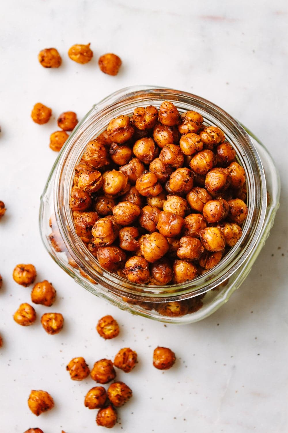 top down view of roasted chipotle chickpeas in a jar.