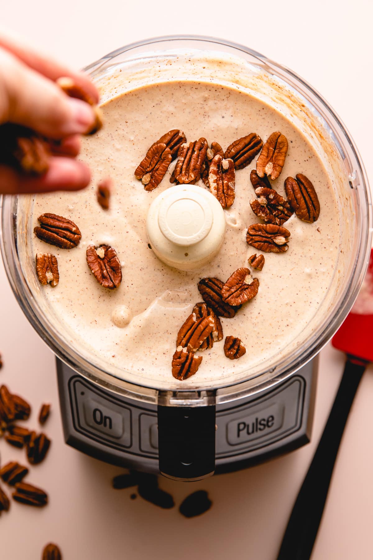 top down view showing process of making vegan butter pecan ice cream.