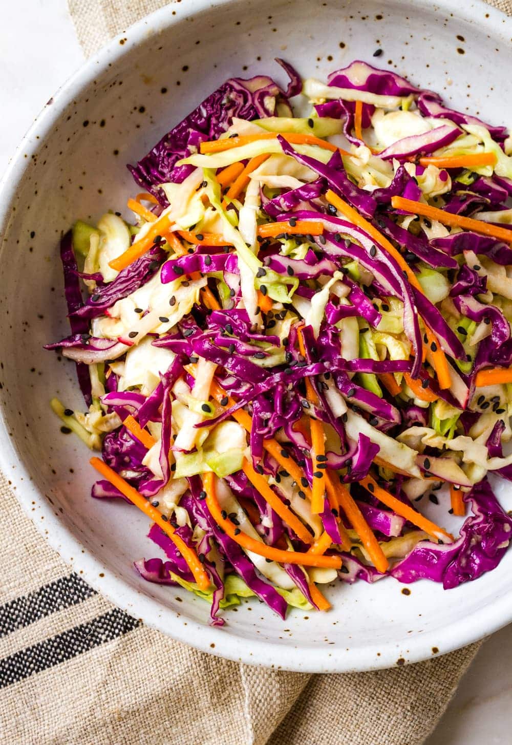 top down view of a serving of asian slaw salad in a bowl.