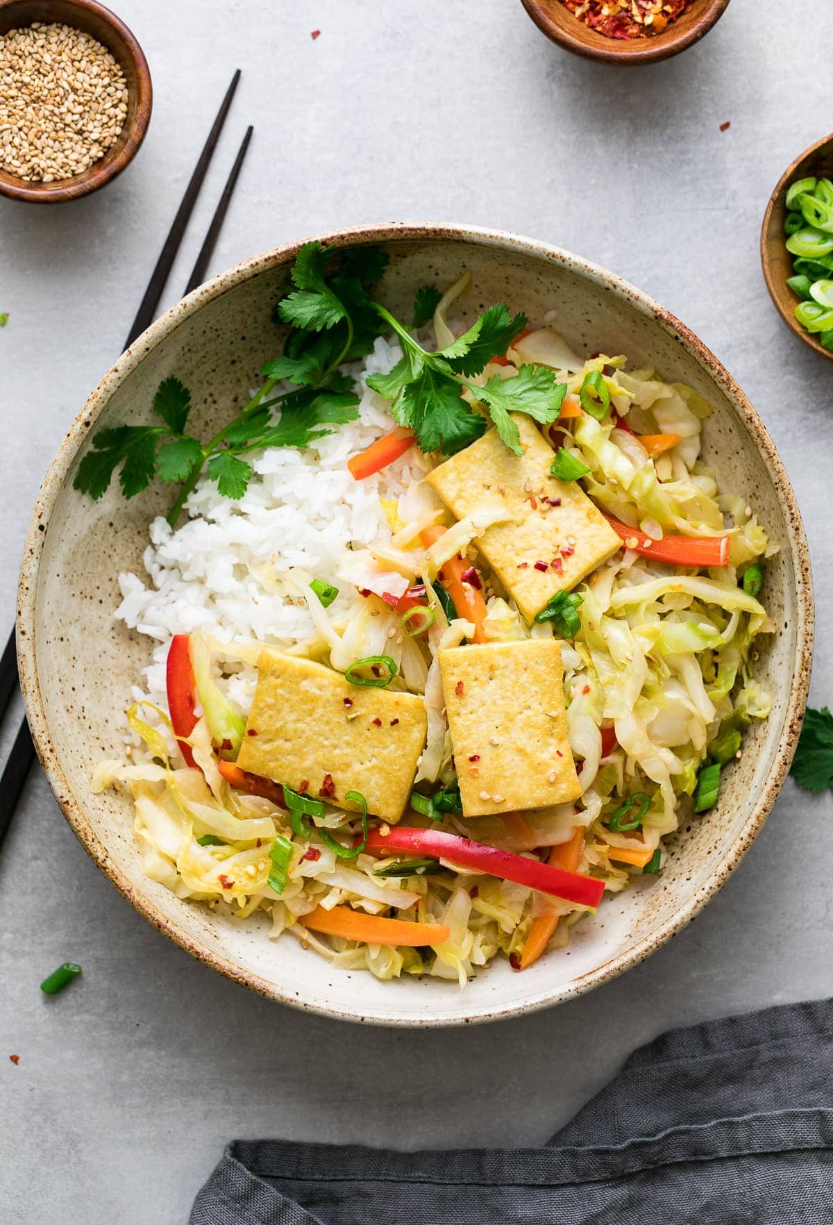 top down view cabbage stir fry with tofu in a bowl.