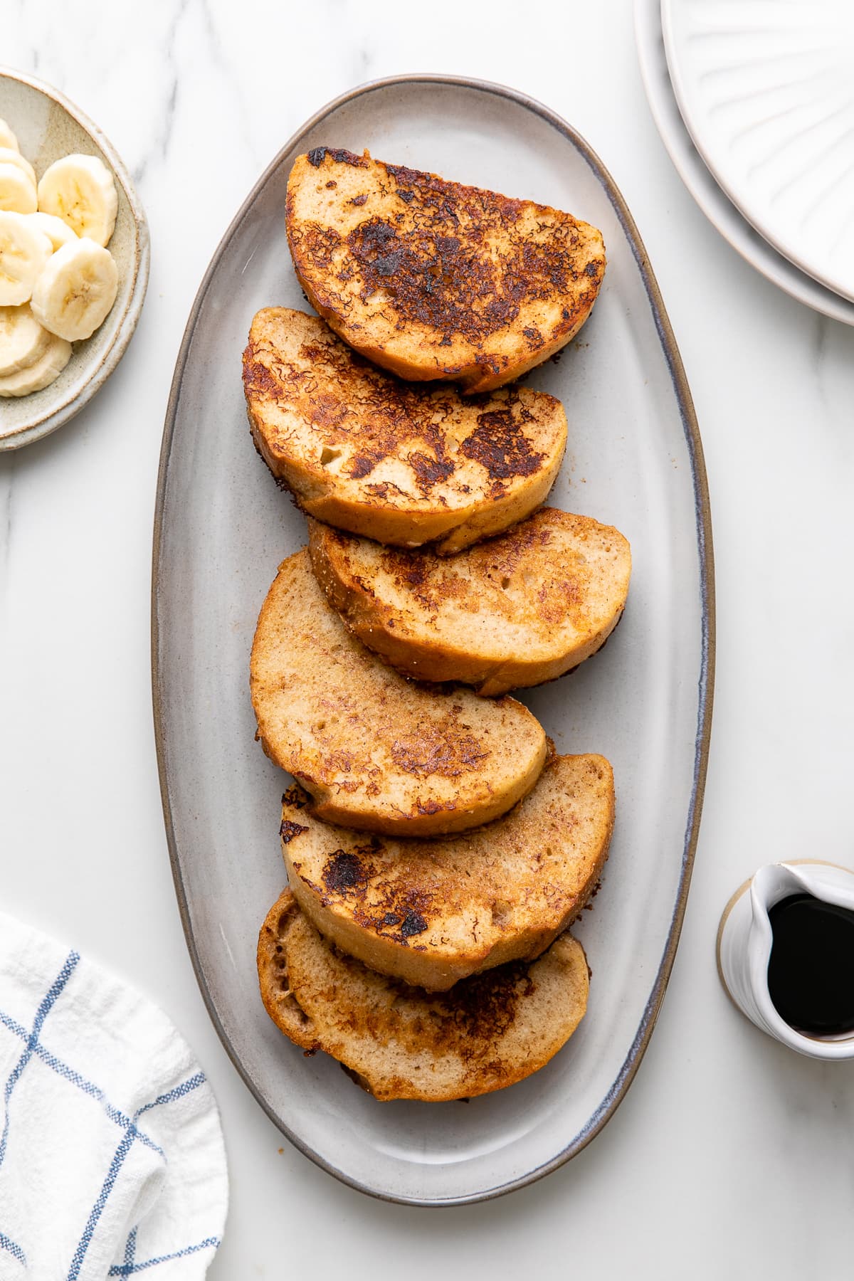 top down view of serving platter with fresh made vegan banana french toast.