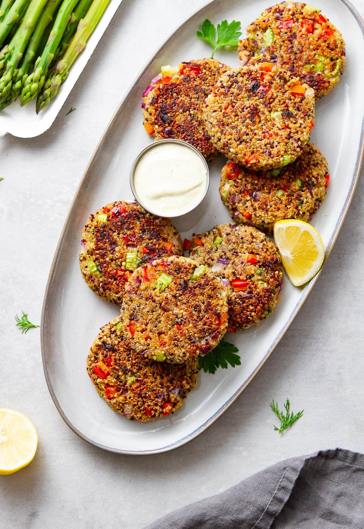 top down view of crispy quinoa cakes on a serving platter.