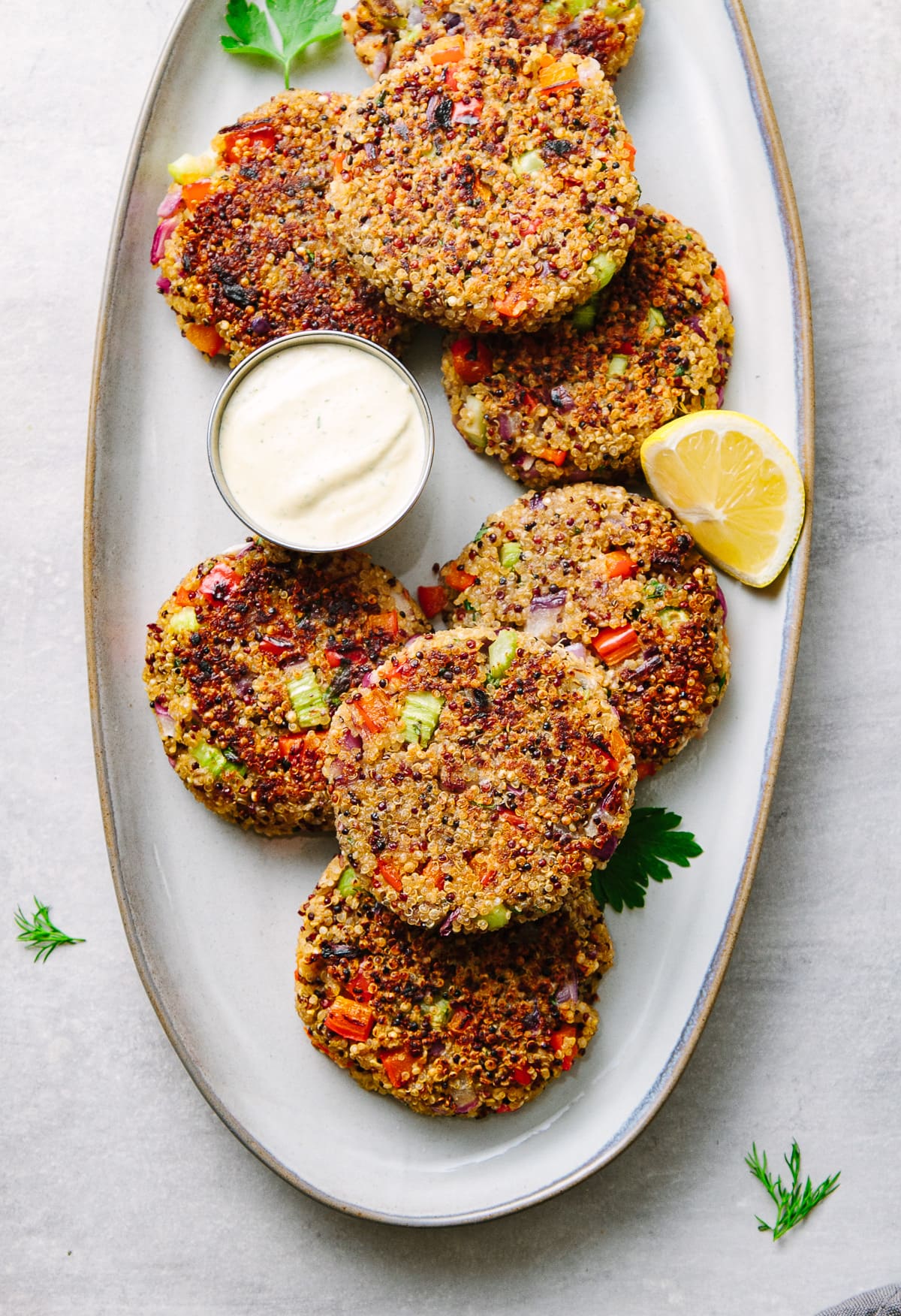 top down view of crispy quinoa cakes on a serving platter.
