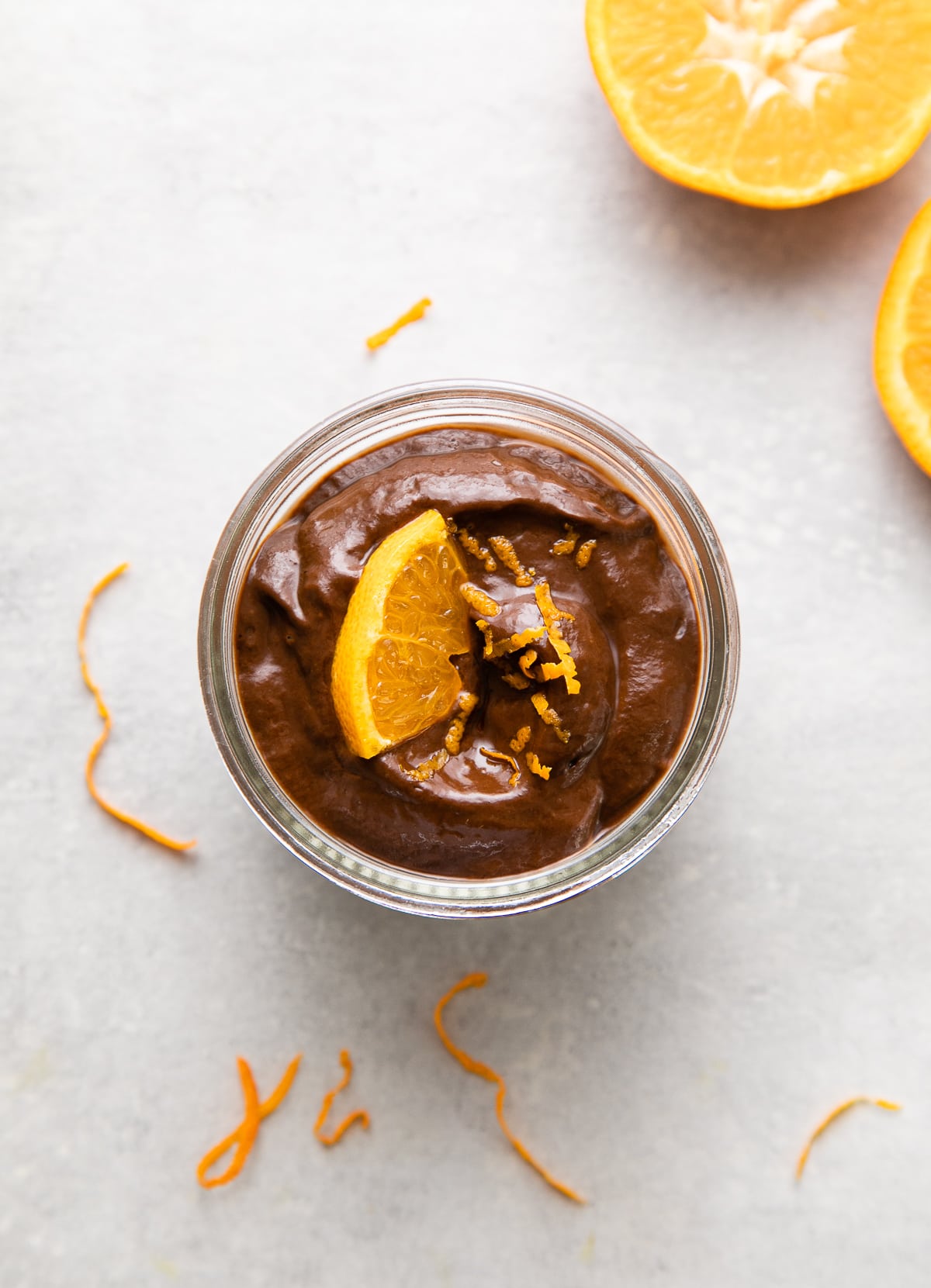 top down view of the best raw chocolate pudding with orange.
