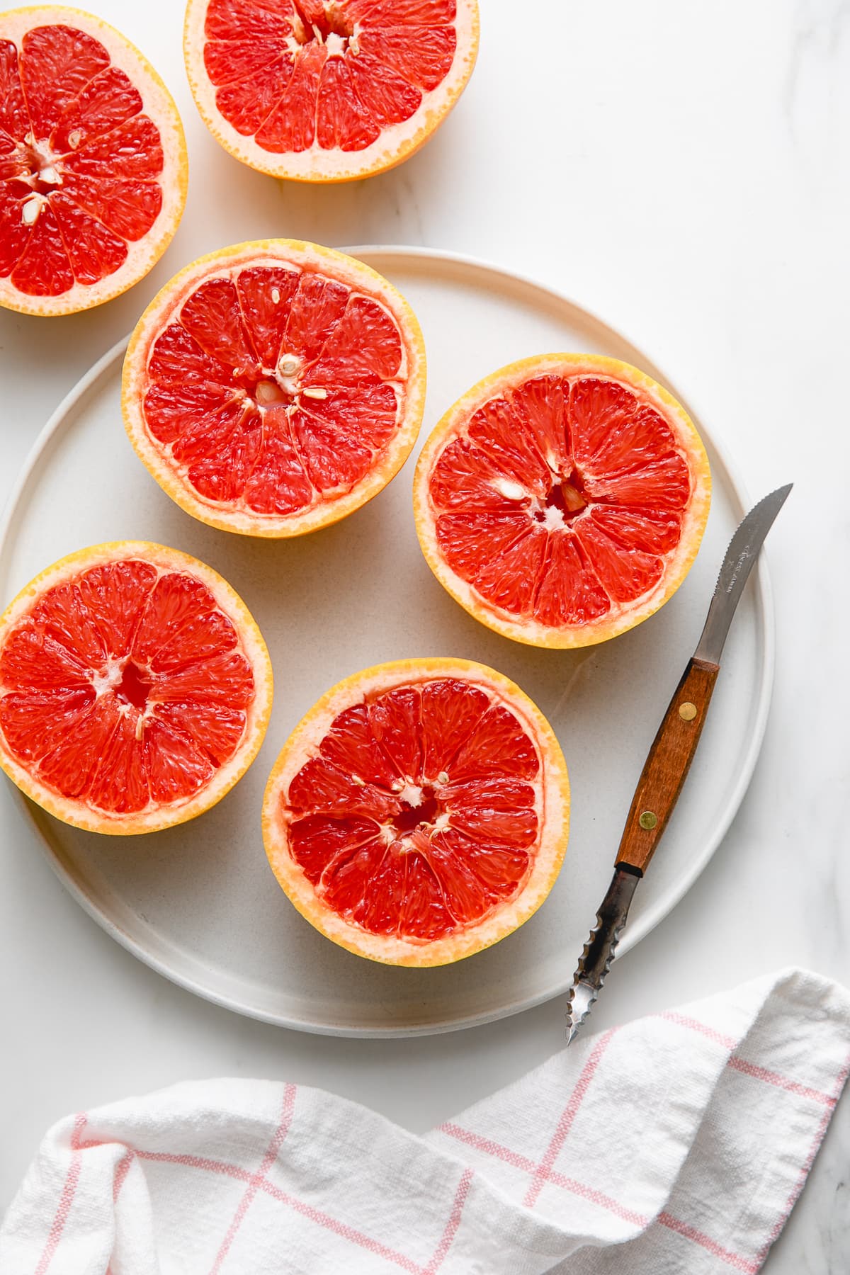 top down view of sliced grapefruit with segments cut.