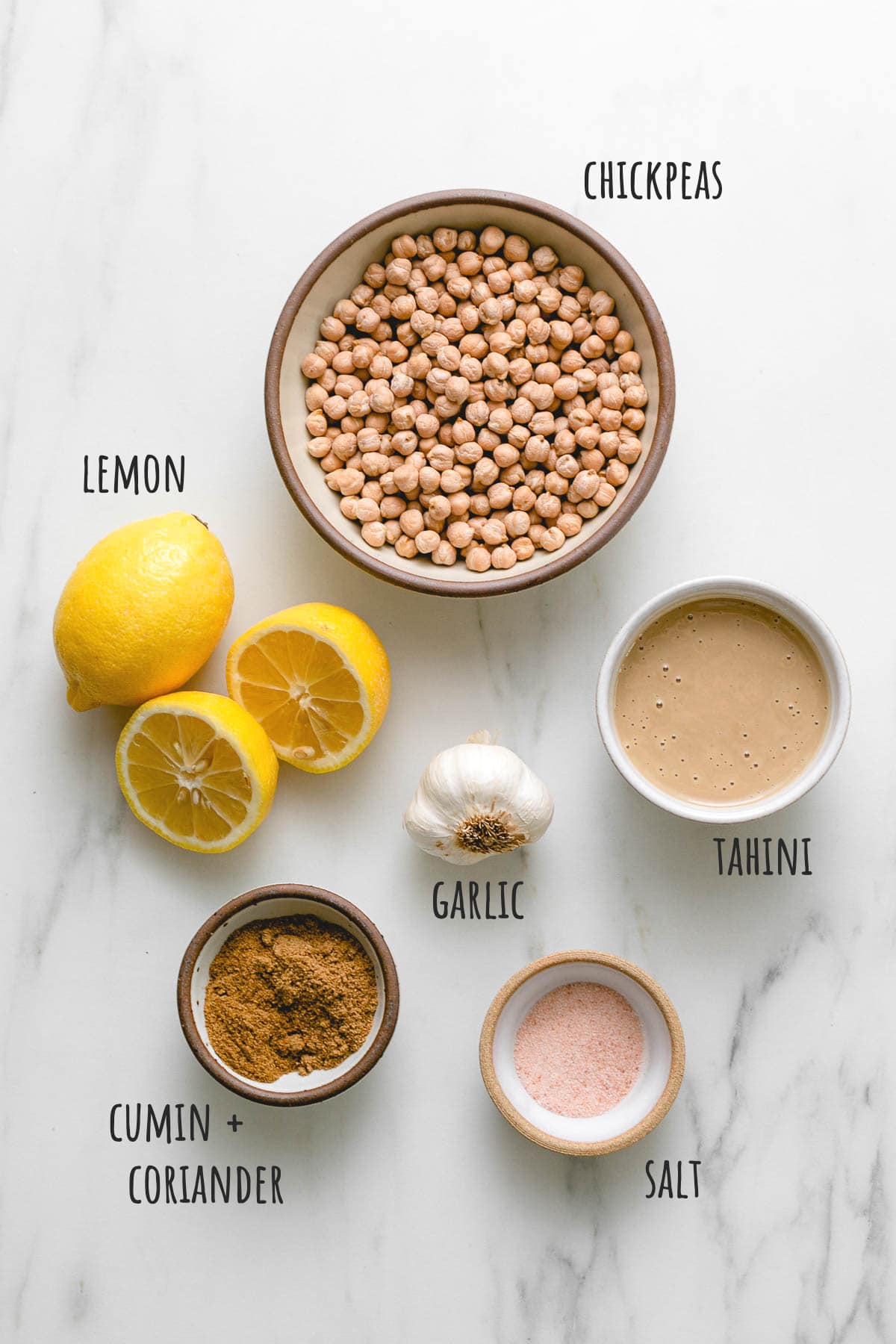 top down view of ingredients used to make raw sprouted hummus with chickpeas.