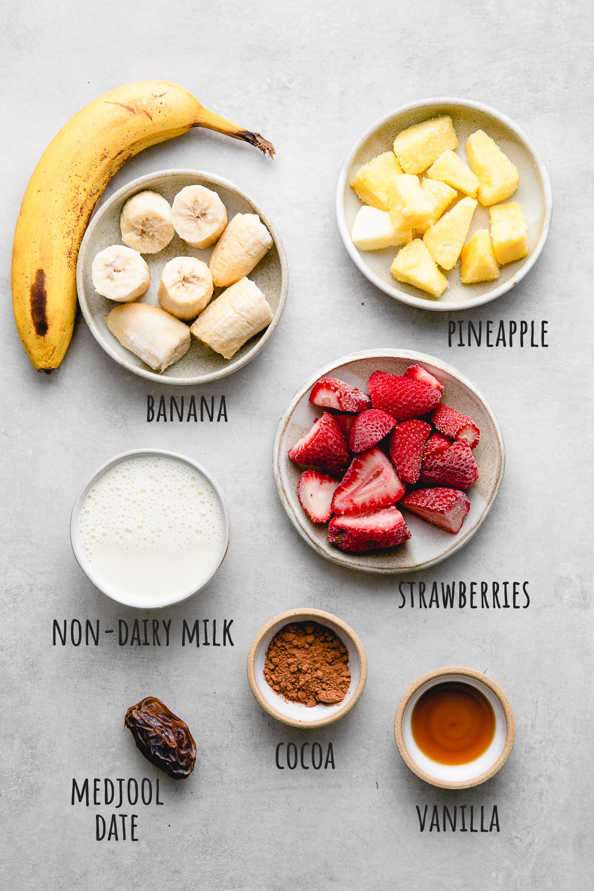 top down view of ingredients used to make vegan banana split smoothie recipe.