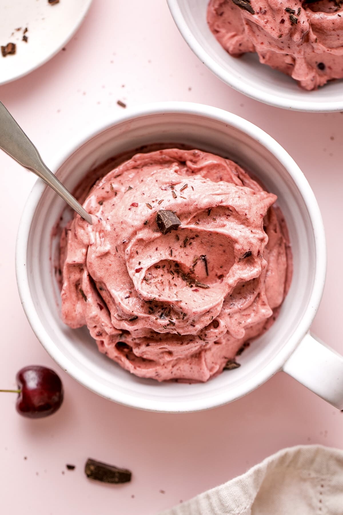 top down view of healthy non-dairy chocolate cherry nice cream in a bowl.