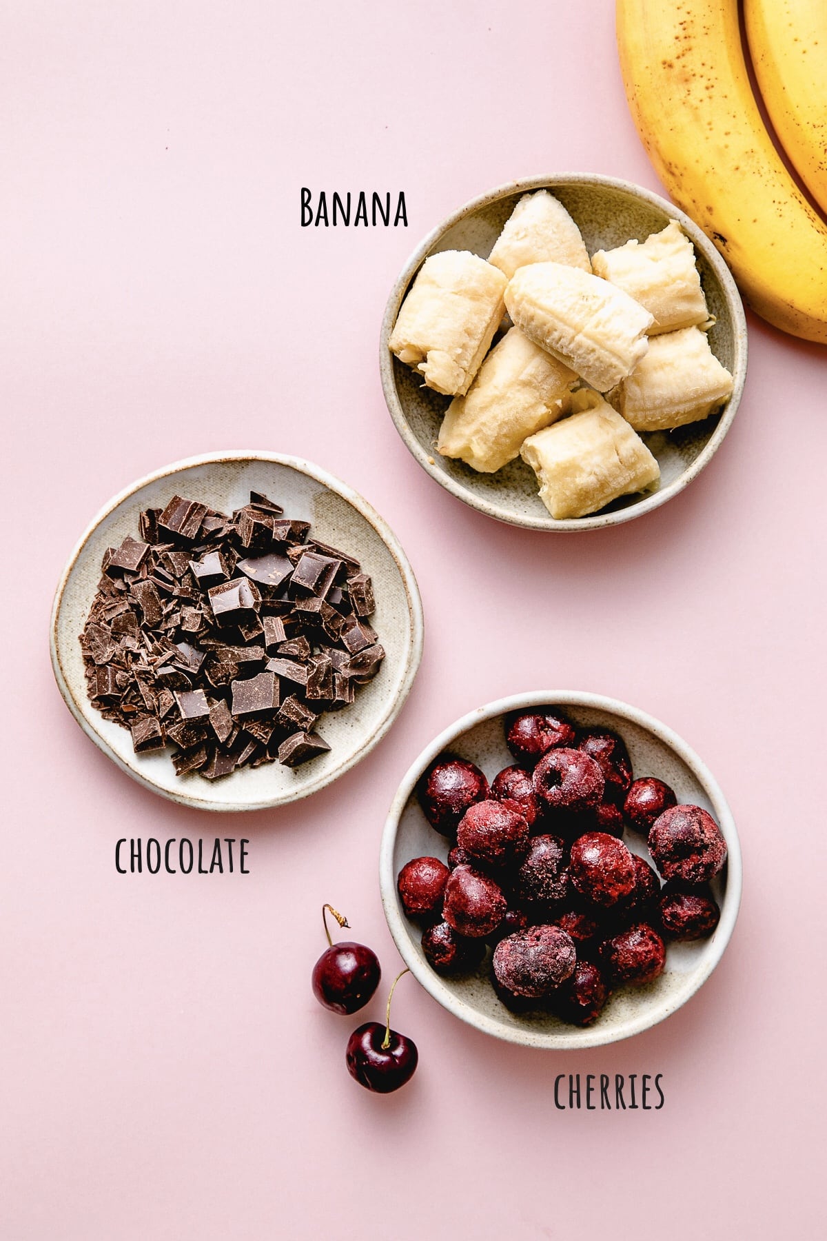 top down view of ingredients used to make healthy chocolate cherry nice cream recipe.