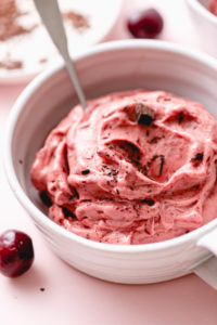 side angle view of healthy non-dairy chocolate cherry nice cream in a bowl.