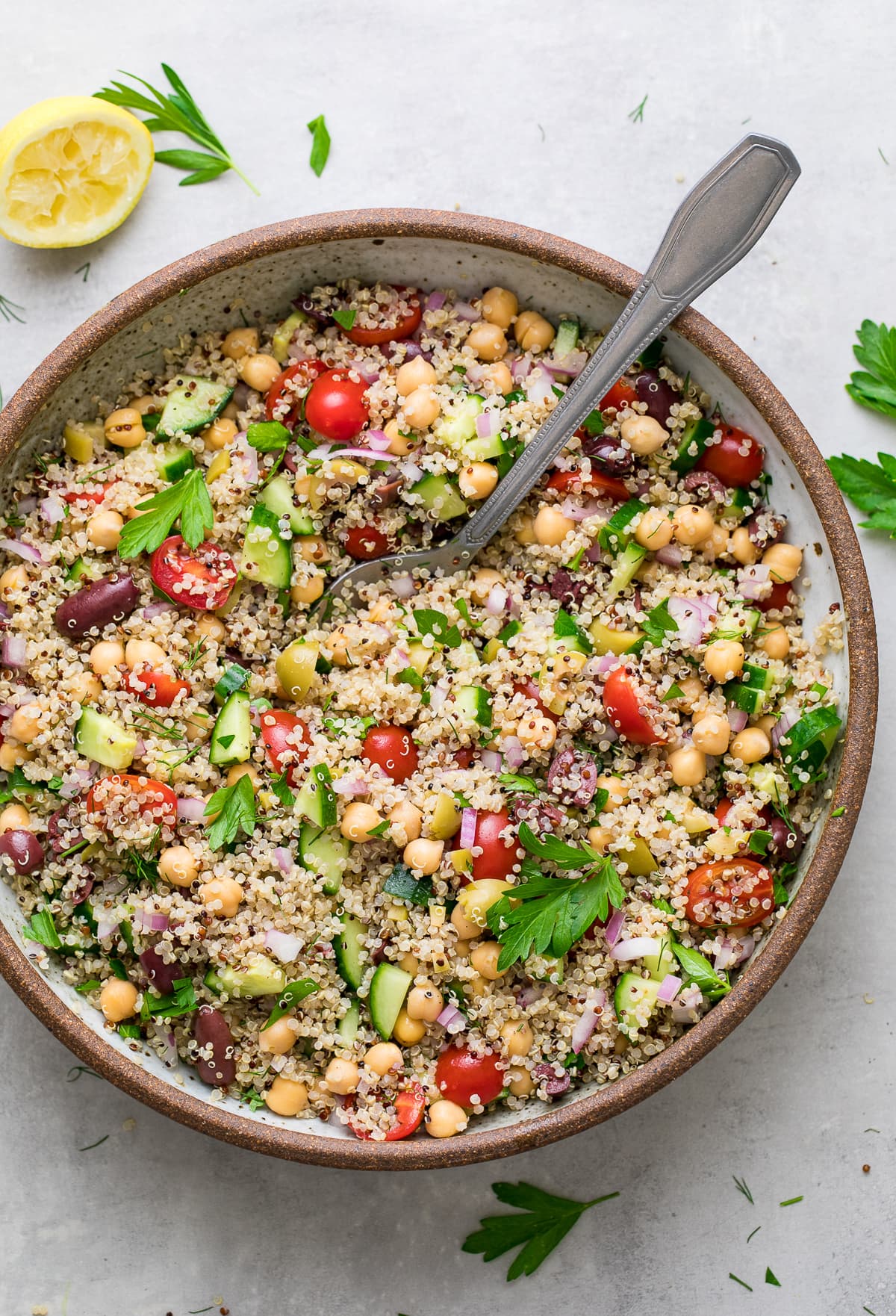 top down view of serving bowl with freshly made Greek quinoa salad.