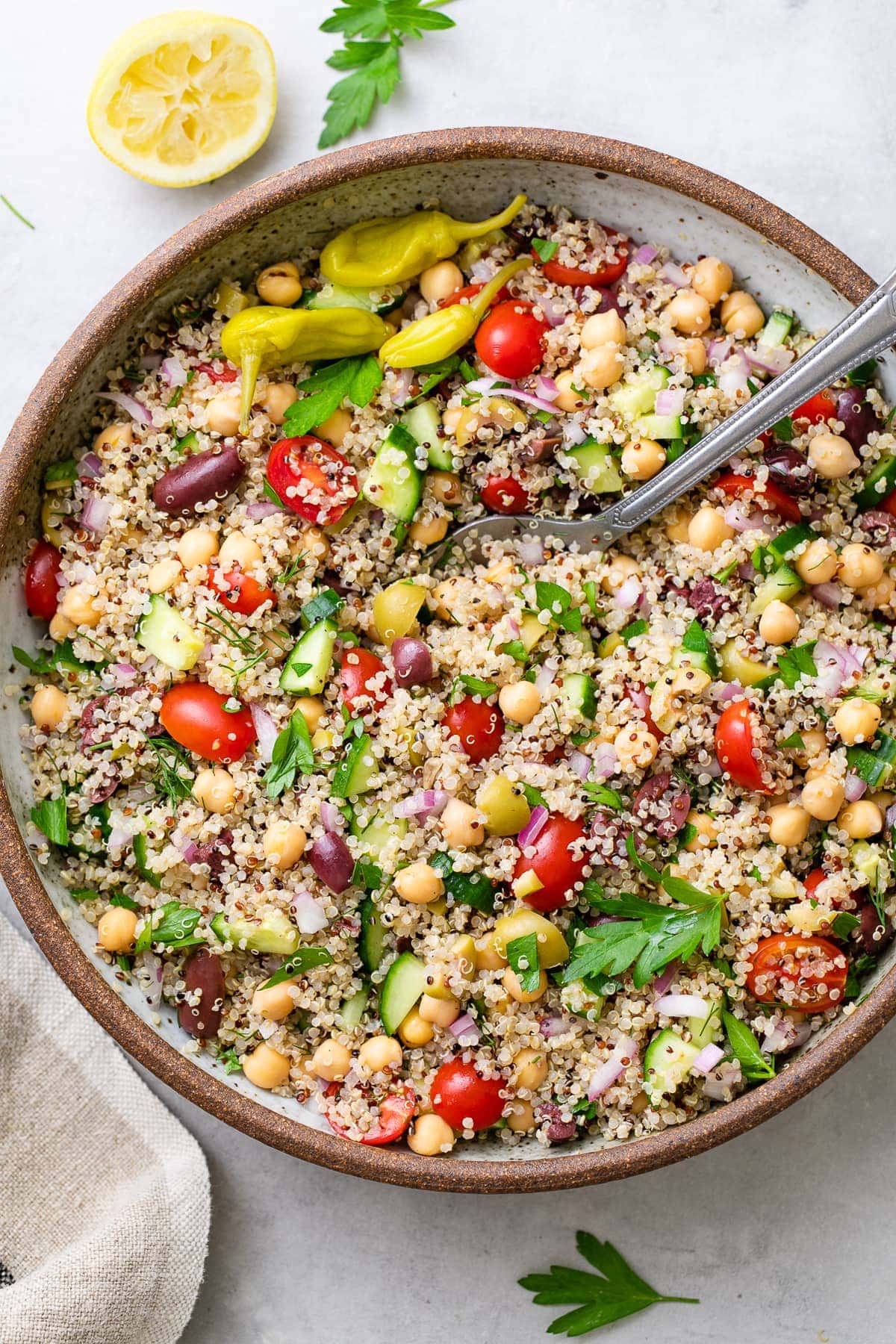 top down view of serving bowl with freshly made Greek quinoa salad.