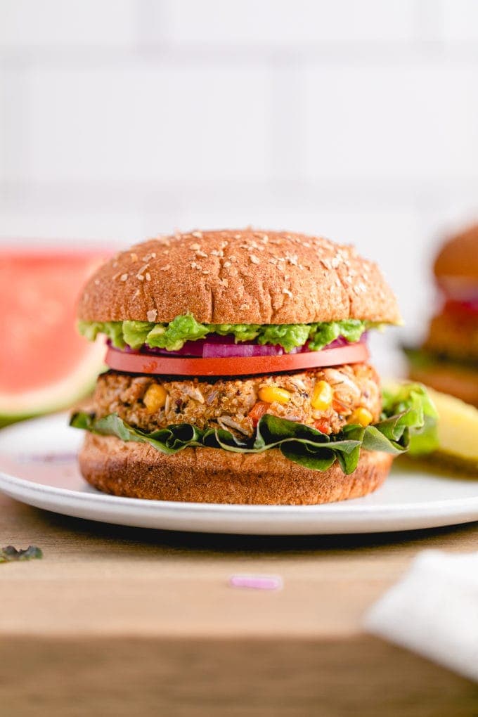 head on view of quinoa white bean veggie burger with all the fixings.
