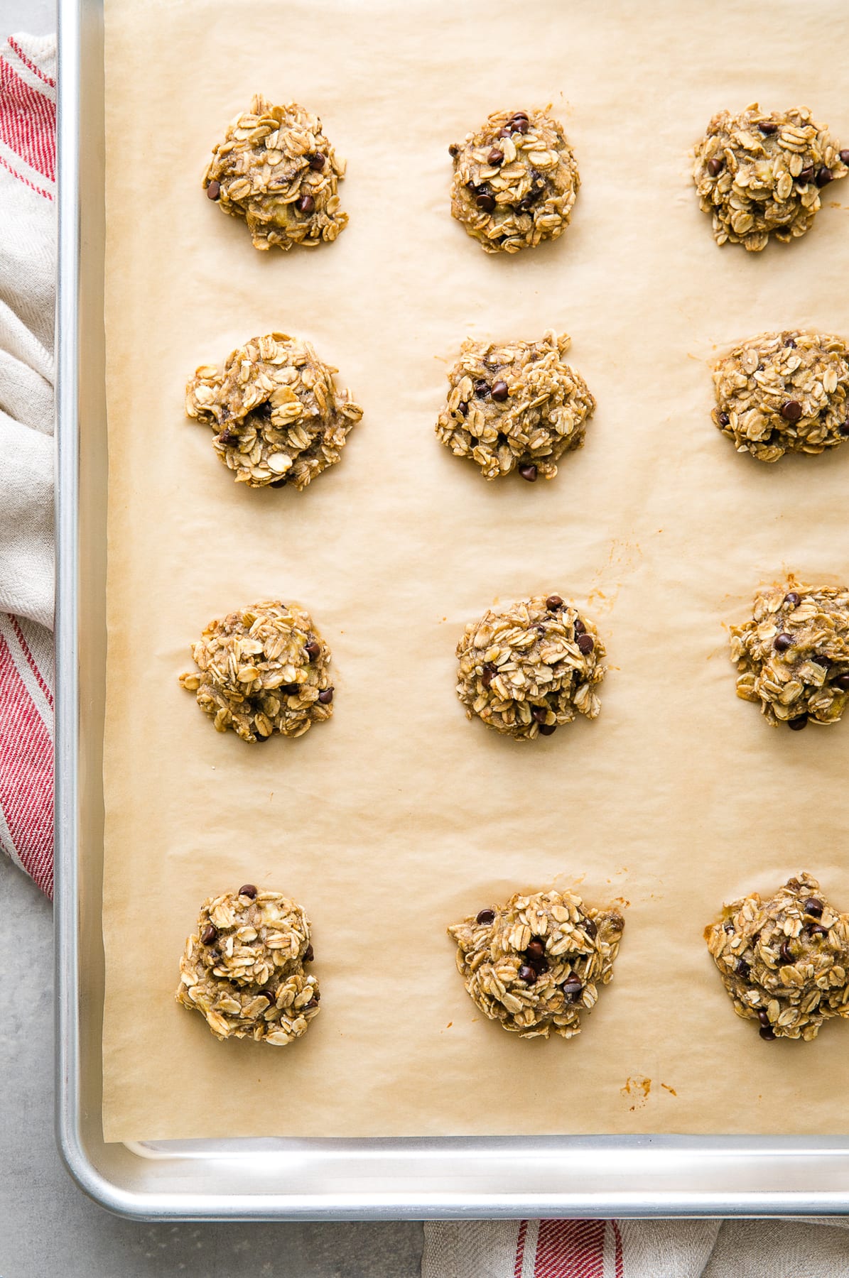 top down view of fresh baked banana oatmeal cookies on a baking sheet.
