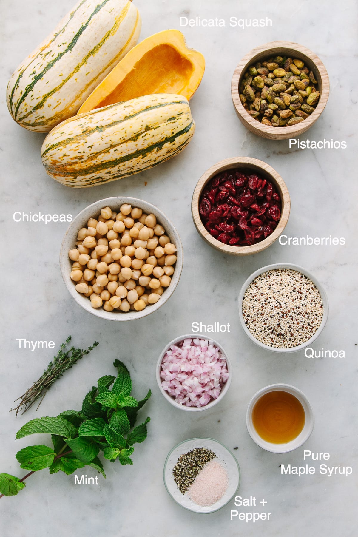 top down view of ingredients used to make stuffed delicata squash with quinoa, chickpeas, cranberries and pistachios.