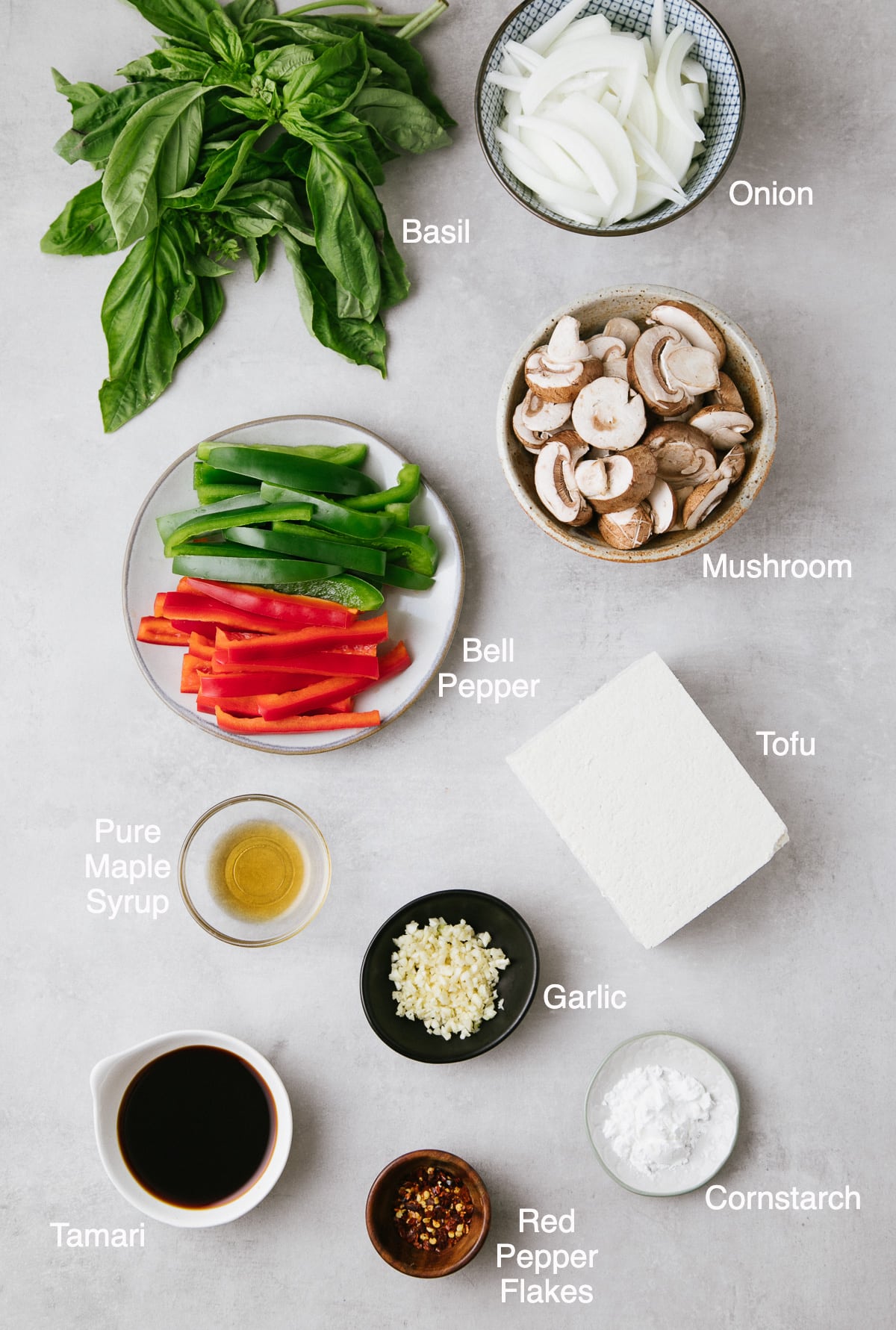 top down view of ingredients used to make basil stir fry with tofu and veggies.