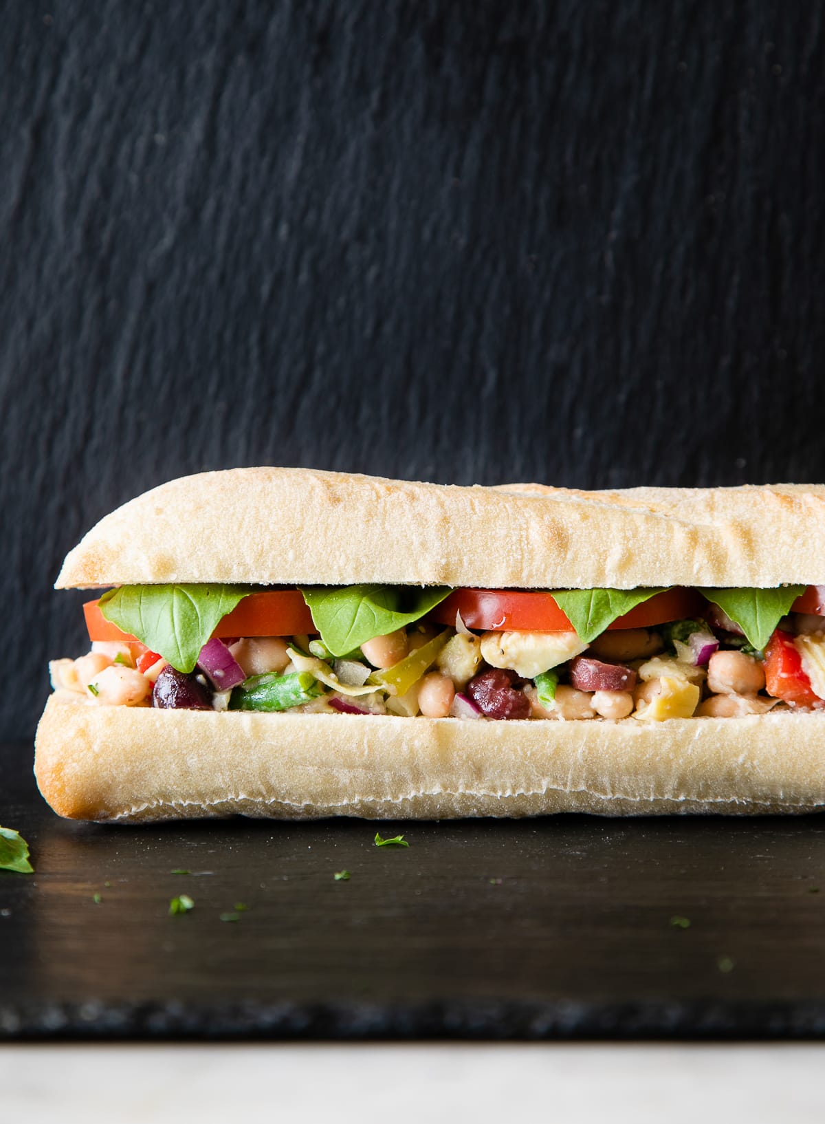 head on view of vegetarian pan bagnat with bean nicoise.